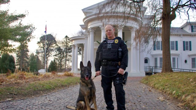 Nebraska City Police Department Sgt. Christopher Richardson with retired K-9 Mack. Richardson championed legislation to authorize emergency medical services care and transportation in the event a K-9 is injured in the line of duty, a bill that passed the Nebraska Legislature in 2024. 
(Courtesy of Sgt. Christopher Richardson)