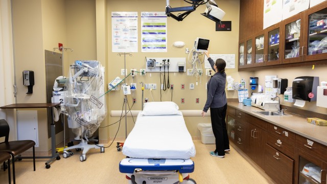 Kristin Salmon, RN, ER trauma coordinator, prepares a trauma bay at Pender Community Hospital. Across the state and country, it has become increasingly difficult for hospitals like the one in Pender to keep doors open. 
(Rebecca S. Gratz / Flatwater Free Press)
