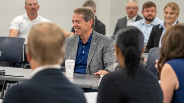 Nebraska Gov. Jim Pillen (center) addresses the new School Financing Review Commission during its first meeting on Aug. 12, 2025. 
(Zach Wendling / Nebraska Examiner)