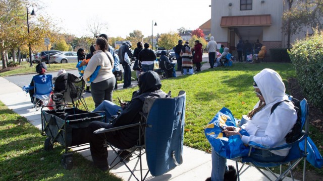 Furloughed federal workers stand in line for hours ahead of a special food distribution by the Capital Area Food Bank and No Limits Outreach Ministries on Barlowe Road in Hyattsville, Maryland, on Tuesday, Oct. 28, 2025.
(Ashley Murray / States Newsroom)