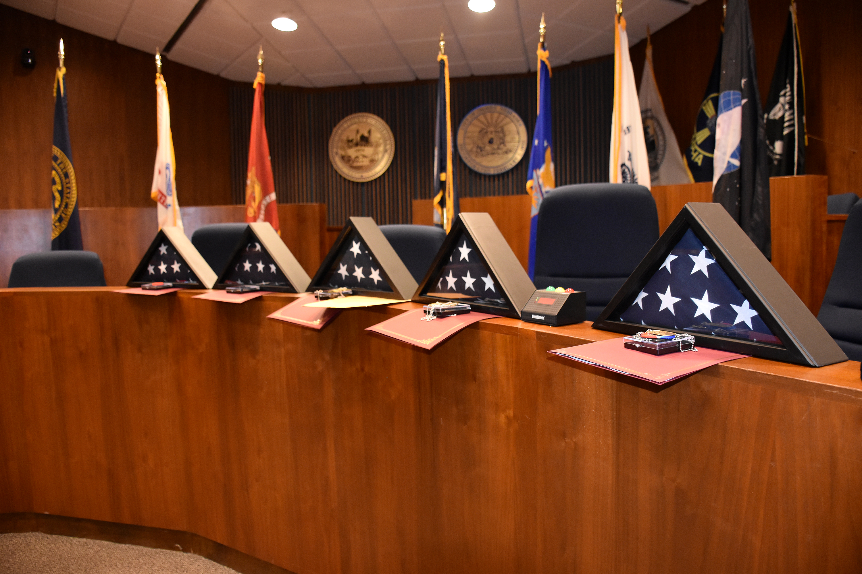 Graduates receive a personalized Veterans Treatment Court graduation certificate, a personalized flag in a triangle box, and their own, personalized graduation dog tag, engraved with “Honor Restored,” the program’s motto. (Carla Chance / The Daily Record)