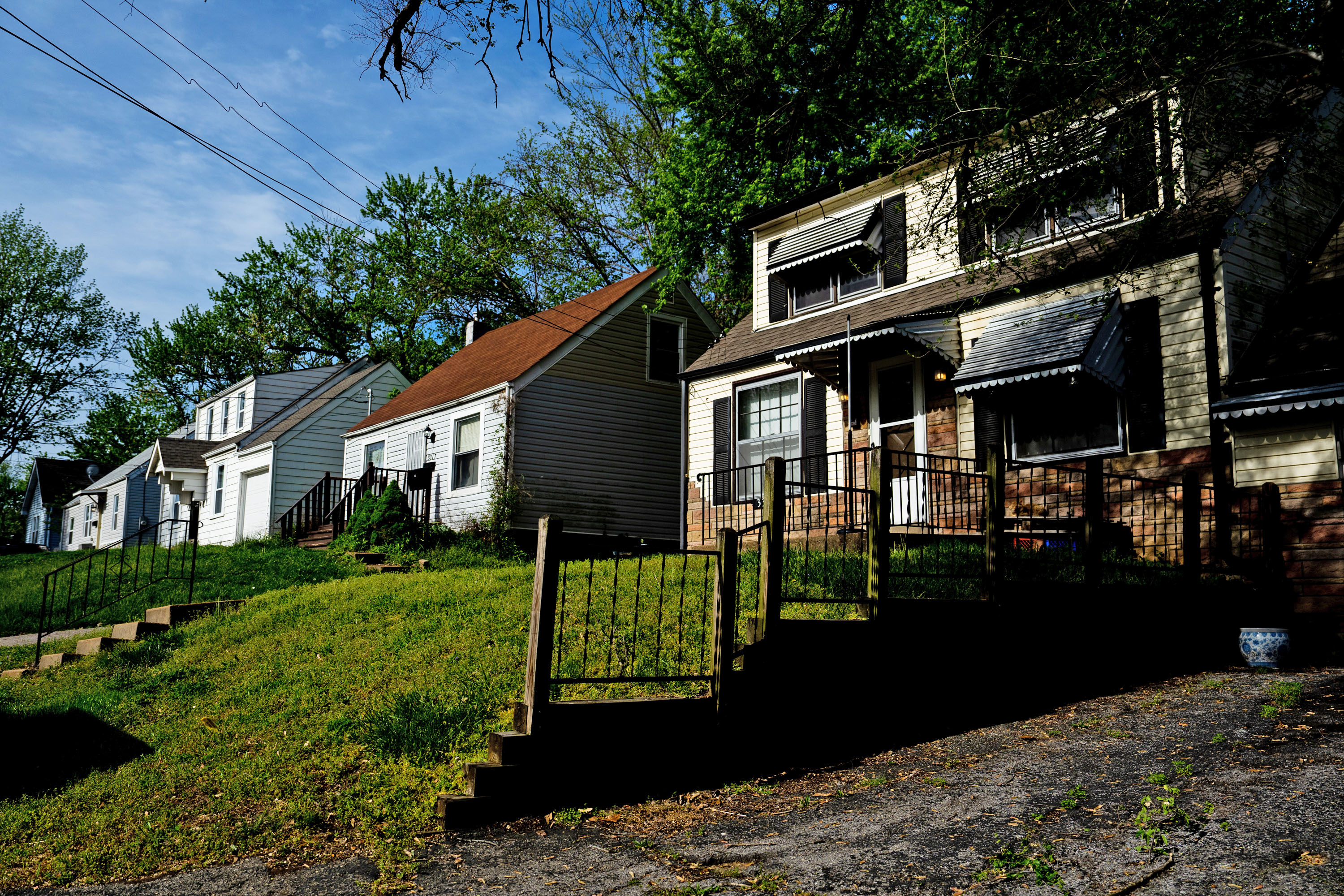 Homes line Rex Avenue on Friday, April 21, 2023, in Breckenridge Hills, Mo. The company’s self-declared strategy is to buy single-family rental properties around the region. A Midwest Newsroom investigation uncovered neglect, aggressive evictions and rising rents where VineBrook moves in – mostly non-white neighborhoods.<br />(Brian Muñoz / St. Louis Public Radio)