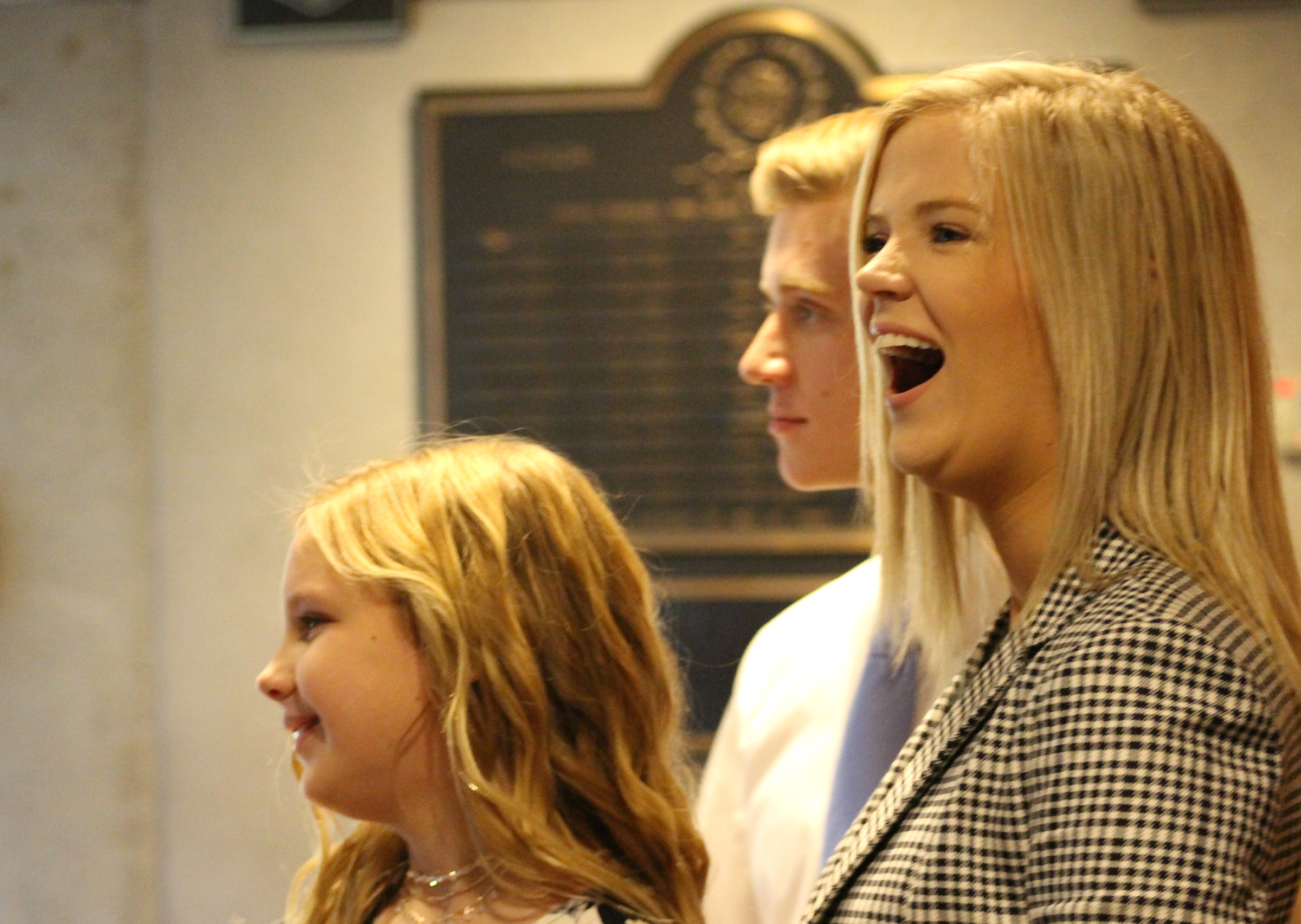 The children of Mary “Peg” M.Z. Stevens laugh just prior to an investiture ceremony in the Legislative Chambers of the Omaha-Douglas County Civic Center on Friday, Jan. 3, 2020. (Photo by Scott Stewart)