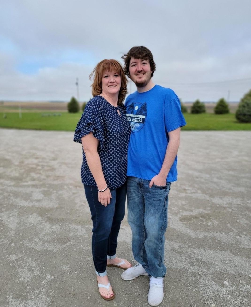 Nick Herringer and his mother Tammy Herringer stand in front of their house northwest of Hastings. Their water, drawn from their privately drilled well, showed a nitrate level of 18 parts per million earlier this year, much higher than the EPA limit of 10 ppm. (Courtesy Photo)