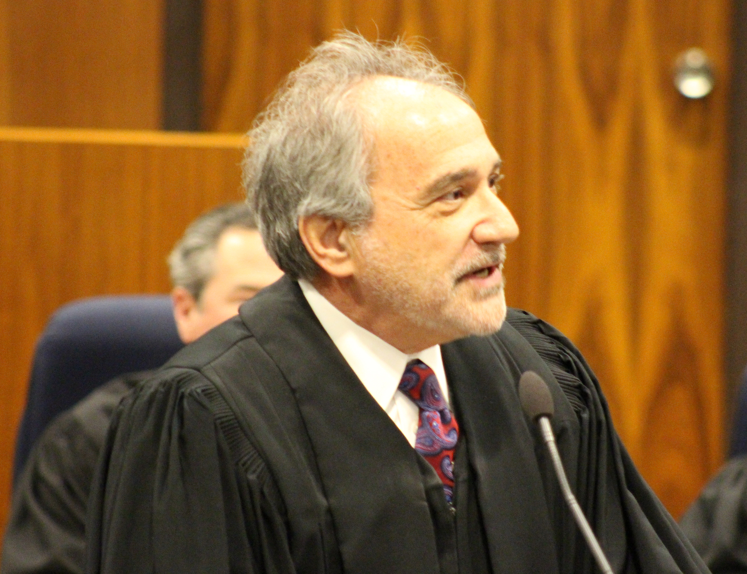 Judge Lawrence D. Gendler delivers remarks during an investiture ceremony in the Legislative Chambers of the Omaha-Douglas County Civic Center on Friday, Jan. 3, 2020. (Photo by Scott Stewart)