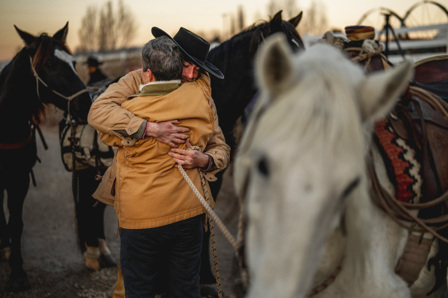 Jake Harvath hugs his mother, Leah, as he arrives at Sage Creek Equestrian in Charleston, Utah on Thursday, Dec. 5, 2024, completing a 6,000-mile, 14-month ride around the U.S.<br />(Spenser Heaps / Utah News Dispatch)