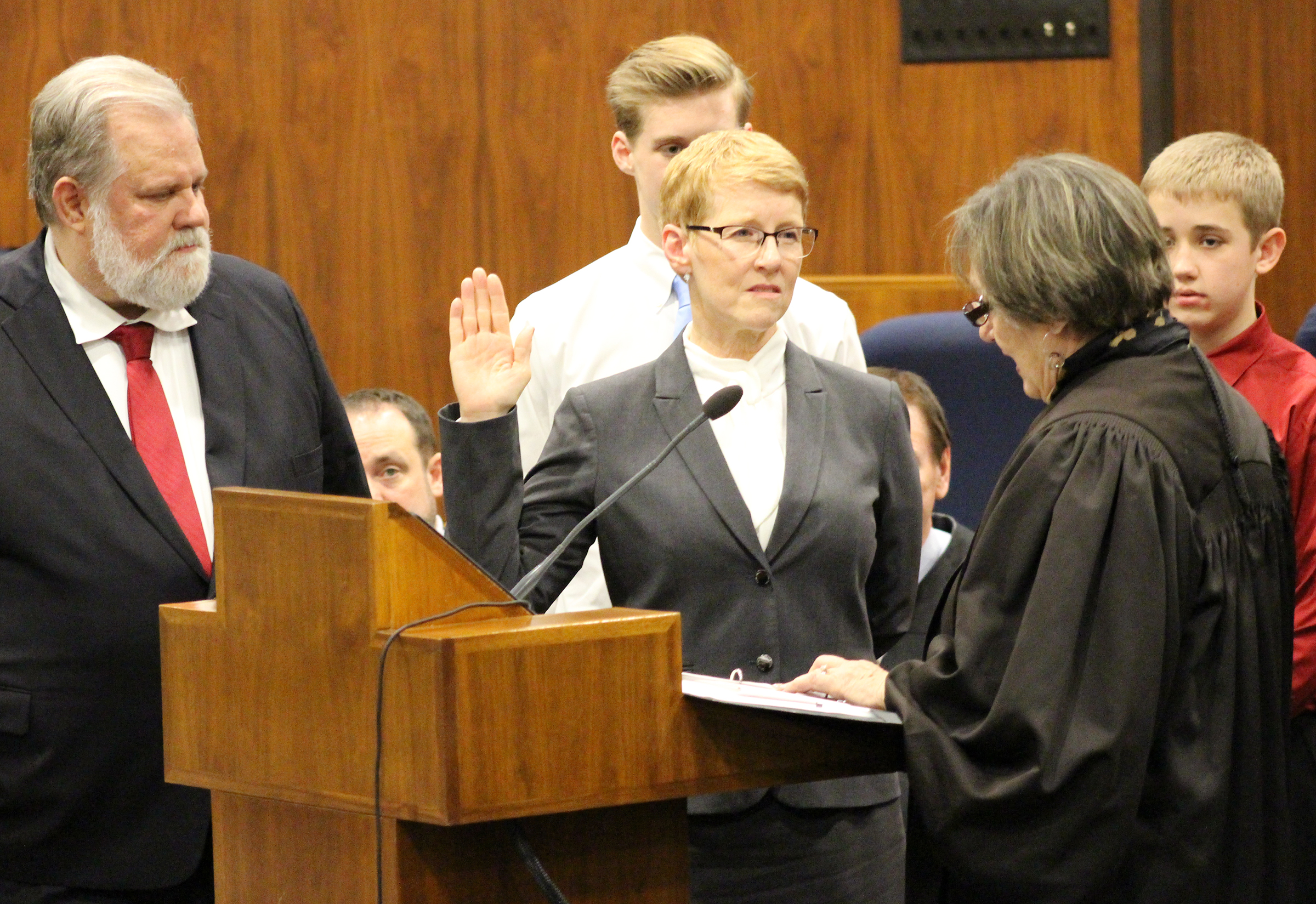 Douglas County Juvenile Court Judge Mary “Peg” M.Z. Stevens takes the oath of office from retired judge Patricia A. Lamberty during an investiture ceremony in the Legislative Chambers of the Oma-ha-Douglas County Civic Center on Friday, Jan. 3, 2020. (Photo by Scott Stewart)