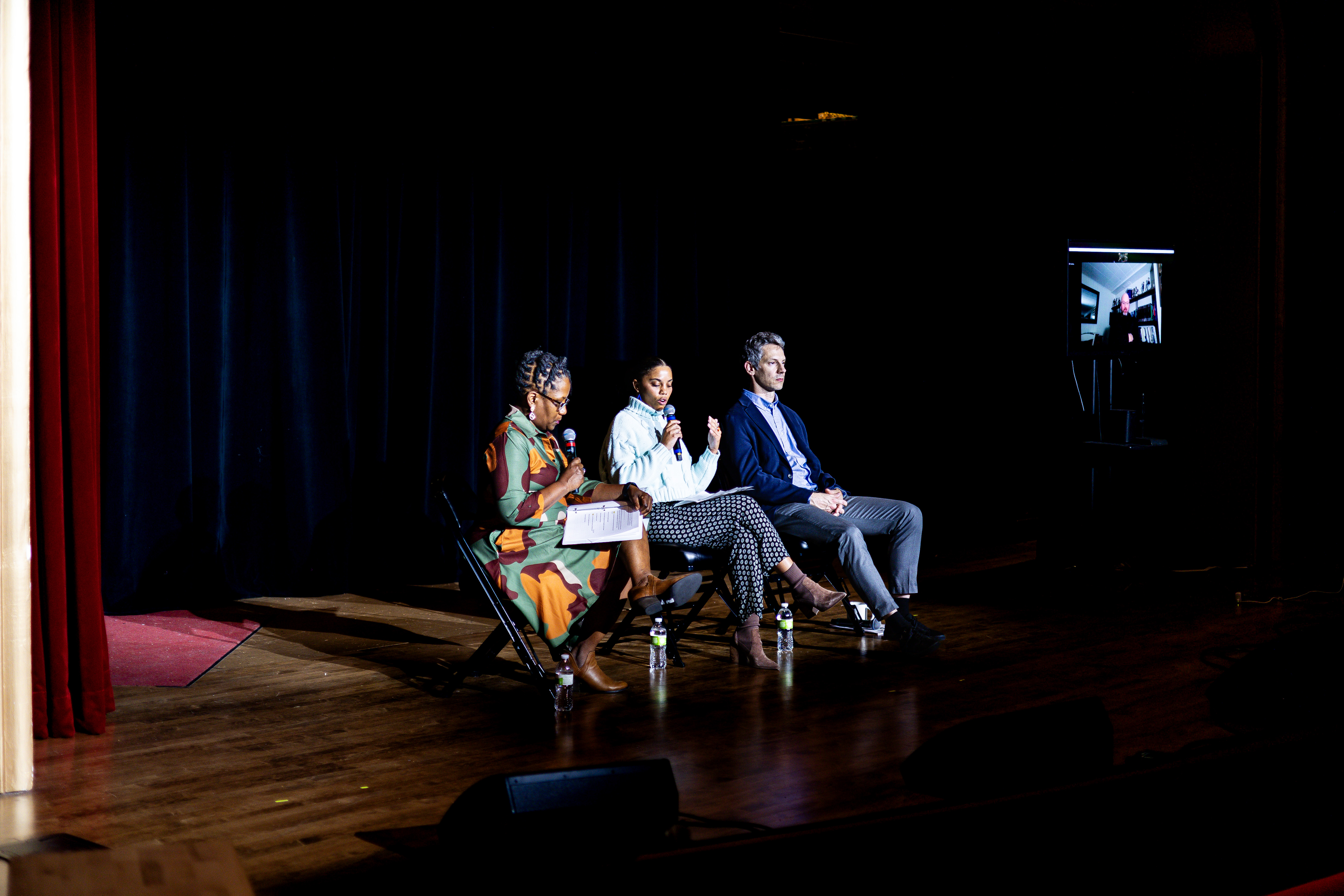Onstage, from left to right, are: Kimara Snipes, executive director of One Omaha; Clarice Dombeck, urban development coordinator at Spark CDI; Greg Paskach, housing director with the City of Omaha’s planning department; Charlie Wesche (on screen), chief of staff and real estate director for NeighborWorks Lincoln.<br />(Courtesy of One Omaha)