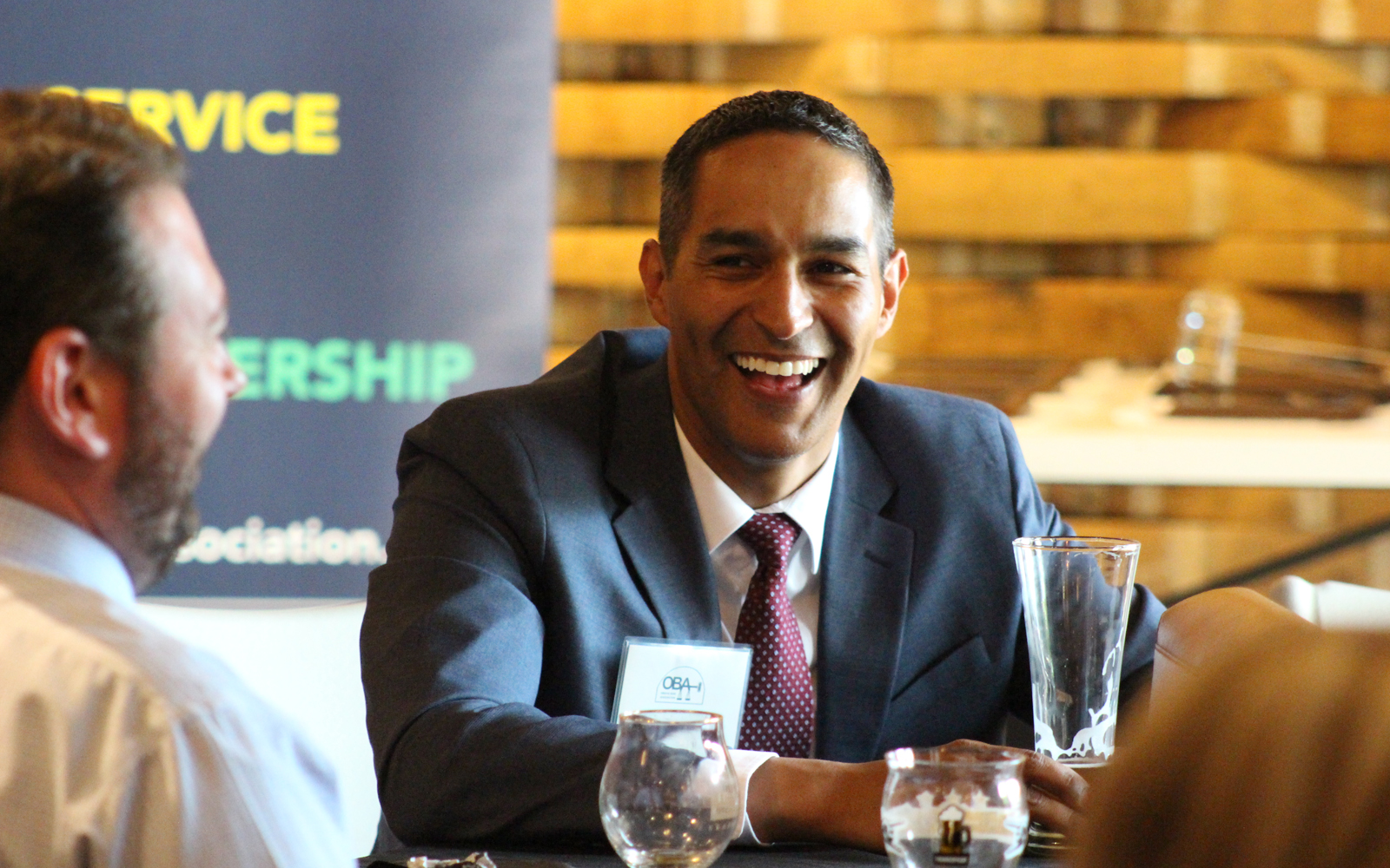Omaha Bar Association President-Elect William Acosta-Trejo smiles during conversation at the OBA President’s Reception on June 4, 2019, at Thunderhead Brewing, 1037 Jones St. (Photo by Scott Stewart)