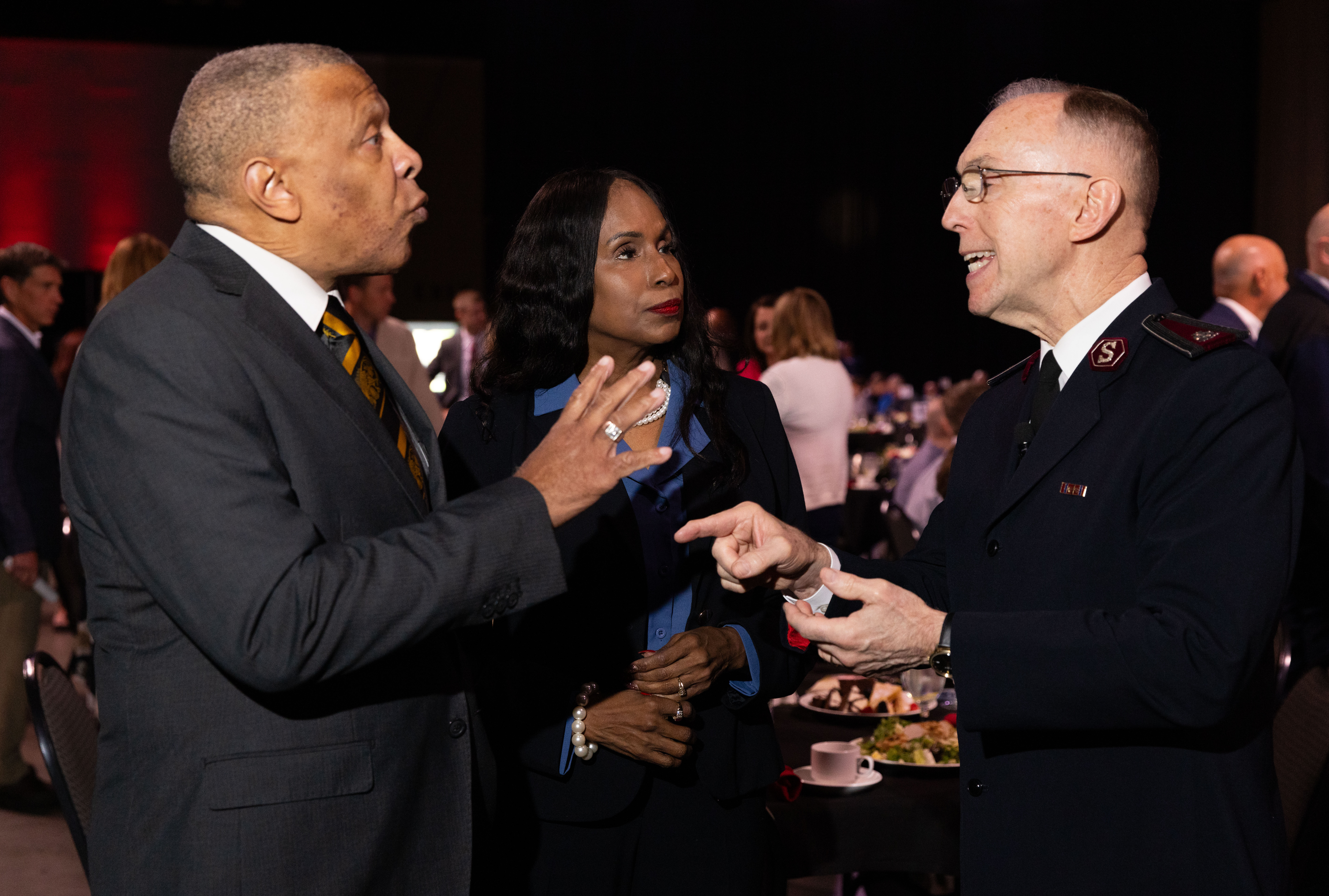 John W. Ewing Jr. and his wife, Salvation Army Advisory Board Chair Dr. Viv Ewing, speak with Commissioner Kenneth Hodder before the D.J.’s Hero Awards Luncheon on May 7, 2024.<br />(Rebecca Gratz / Rebecca Gratz Multimedia)