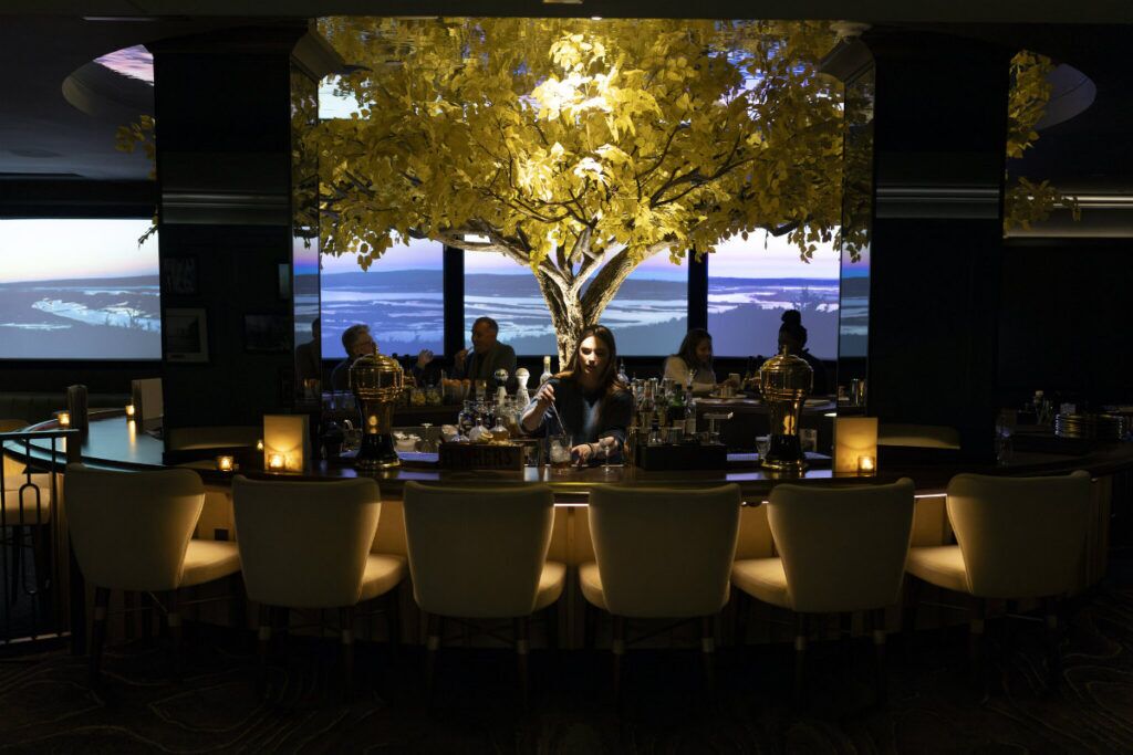 A bartender makes a Manhattan in The Cottonwood Room, the hotel’s bar.<br />(Ryan Soderlin / Flatwater Free Press)