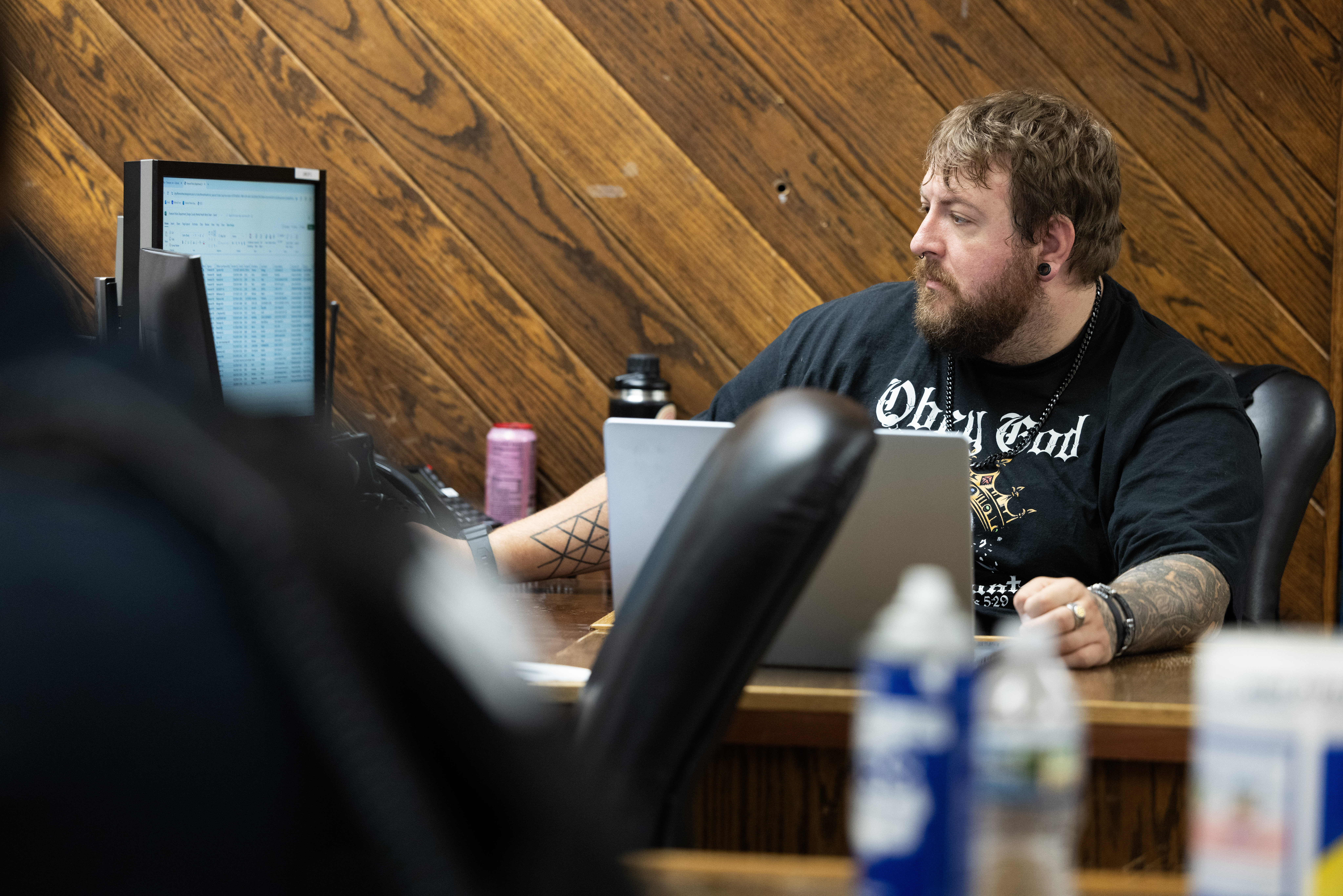 Mental health co-responder Jon Thomsen at work in the Fremont Police Department. When he’s not actively responding to calls, Thomsen makes follow-up calls to help ensure people get the help they need.<br />(Rebecca S. Gratz / Flatwater Free Press)