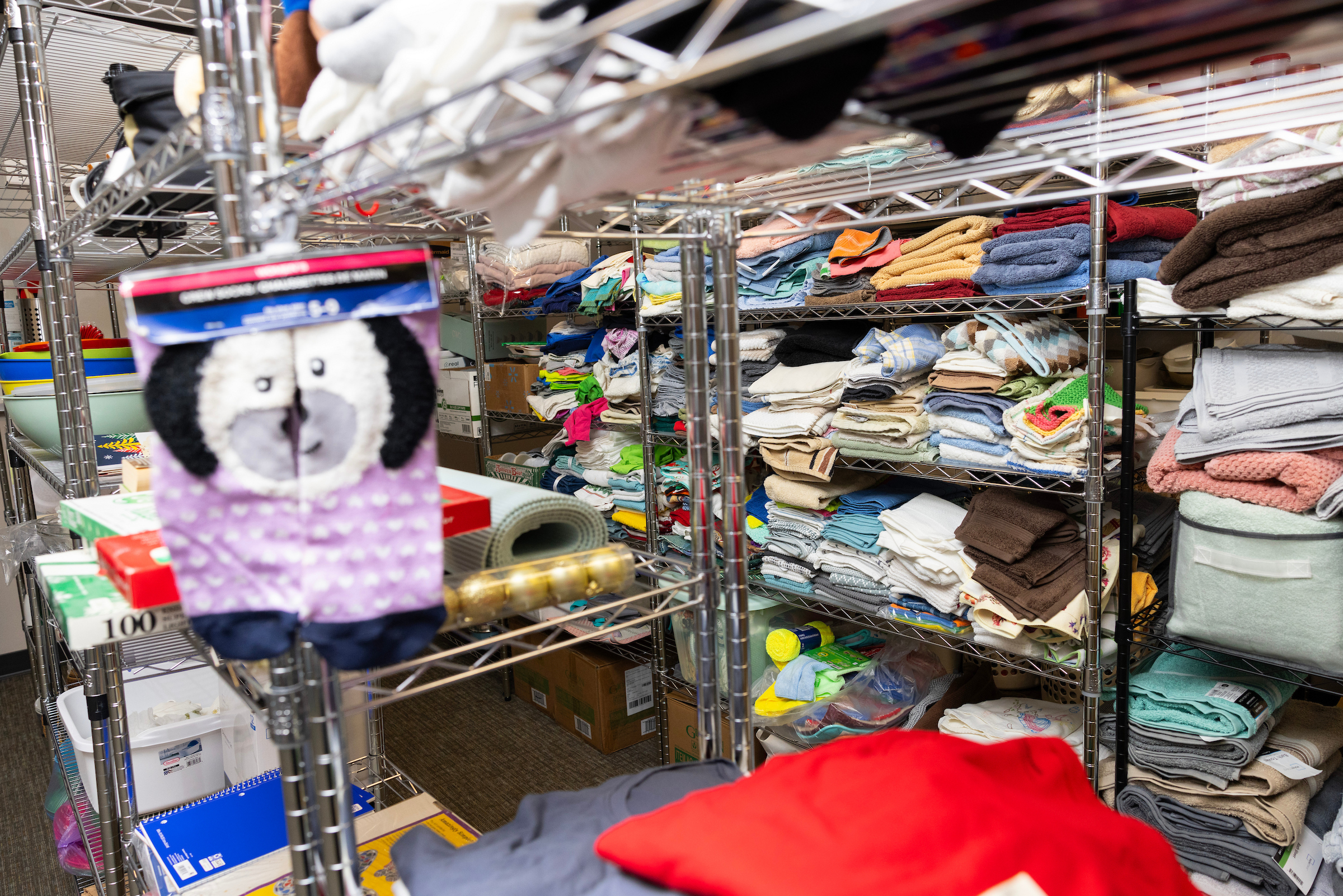 Racks of donated household items await use in the Root &amp; Rise Program, which provides housing for 18-25 year olds who have aged out of the foster care system on the former Dana College campus Friday, Sept. 12, 2025, in Blair, Neb.<br />(Rebecca S. Gratz / Nebraska Examiner)