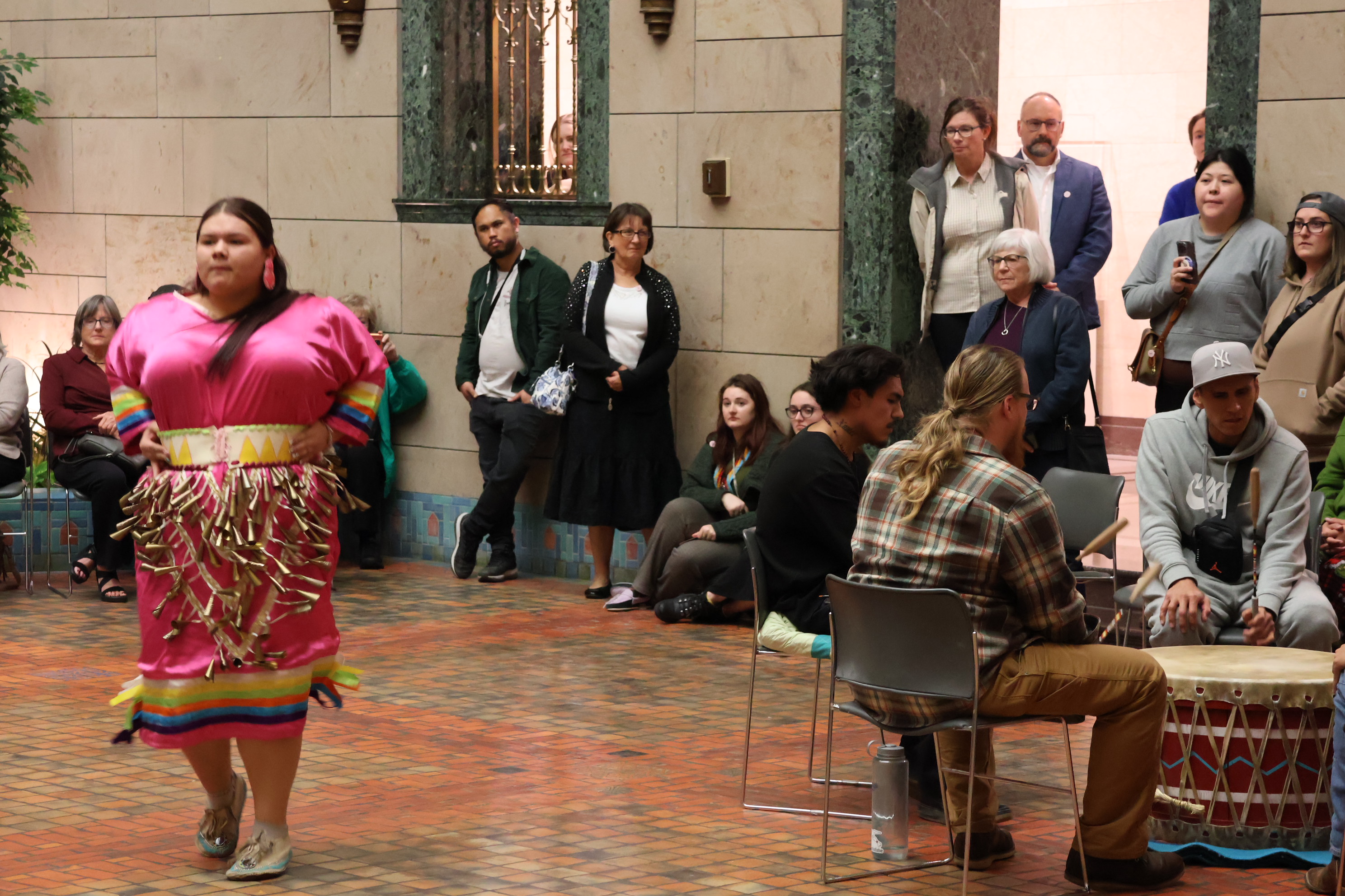 A dancer performs a jingle dance, considered a healing prayer. The dancer keeps one foot on the ground while the jingle sounds send energy to spirits.<br />(Tim Trudell / The Daily Record)
