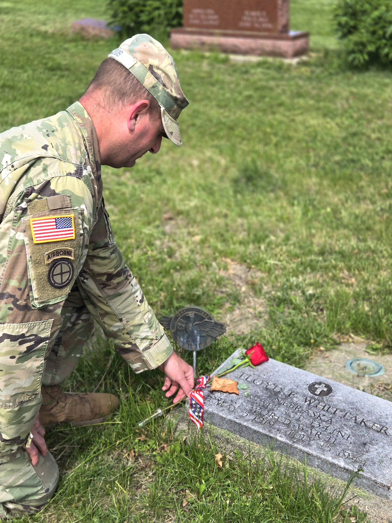 In addition to the memorial run to remember the 53 Nebraska National Guards, who lost their lives in the liberation of St. Lo, France, in World War II, Guardsmen clean the fallen’s graves, placing flowers and coins on the headstones. The gesture is a show of honor and respect, as well as letting the deceased service member’s family know someone was there.<br />(Courtesy of the Nebraska National Guard Museum)