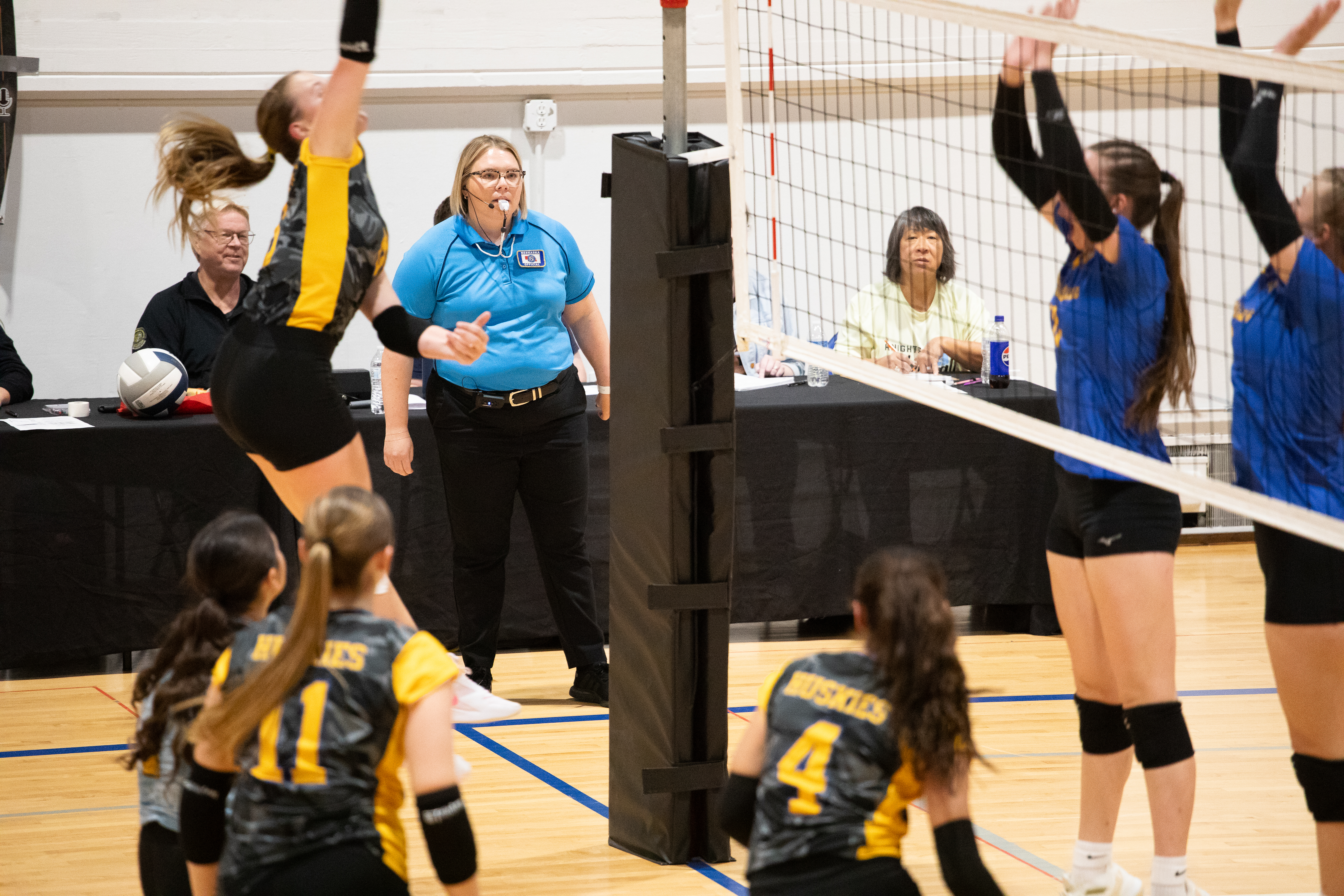 Emma Kwapnioski watches from the side of the court as the Shelby-Rising City Huskies and Nebraska Lutheran Knights play in the semifinals of the Crossroads Conference volleyball tournament.<br />(Liz McCue / Flatwater Free Press)