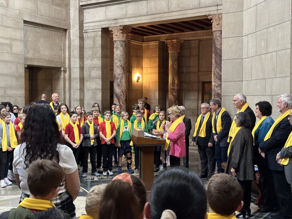 State Sen. Lou Ann Linehan of Omaha speaks to a group of about 85 students from area private schools about her “opportunity scholarship” bill, Legislative Bill 753. (Aaron Sanderford / Nebraska Examiner)