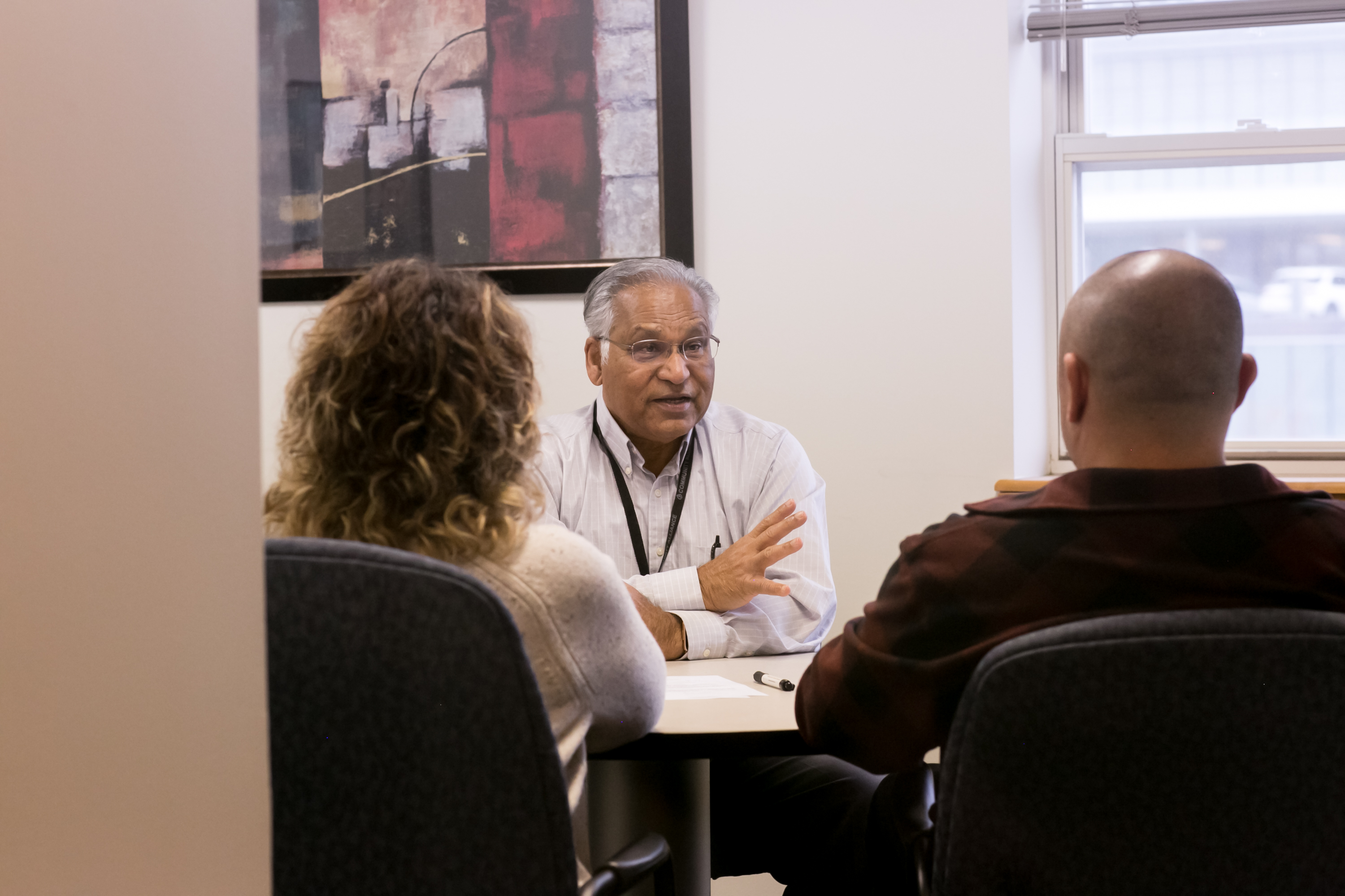 A therapist visits with people at Community Alliance.<br />(Courtesy Community Alliance)