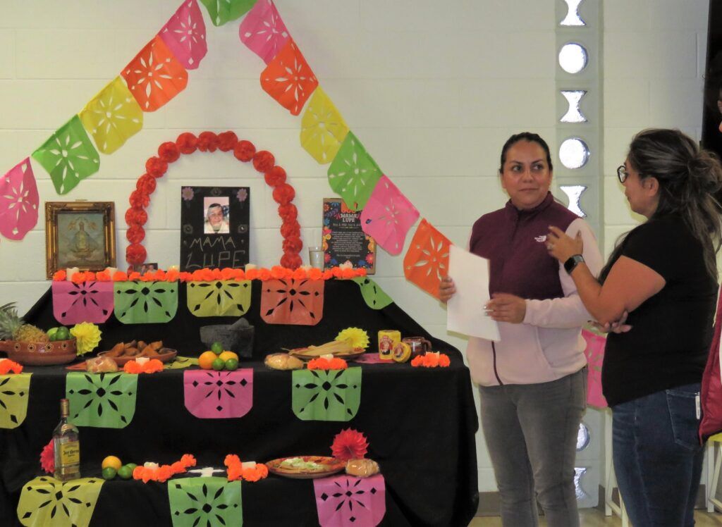The Oct. 29, 2024, mixer at North Platte’s Episcopal Church of Our Savior featured an ofrenda, or offering, display made by Tere De La Torre in remembrance of TinaMaria Fernandez’s grandmother of Mexico. The mixer included newer residents learning English, and many longtime North Platte residents who are now learning Spanish.<br />(Lori Potter / Flatwater Free Press)