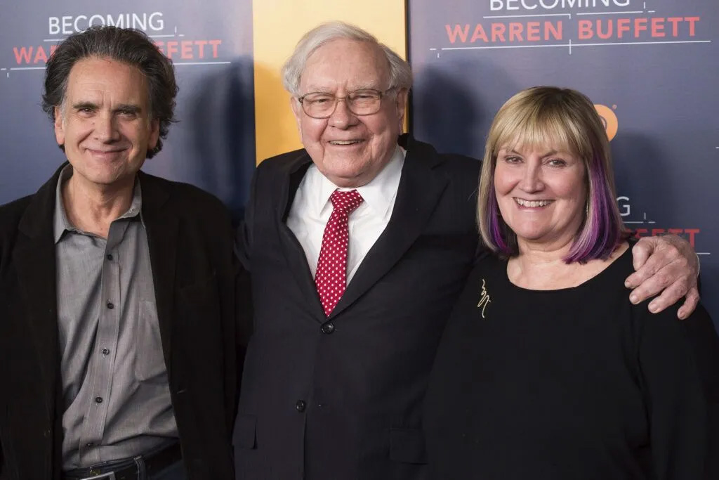 Warren Buffett (center) with two of his three children, Peter and Susie Buffett, at the screening of HBO’s “Becoming Warren Buffett” in New York City in January 2017. Warren Buffett’s decision to leave his money to his children to give away after he dies could result in a flood of philanthropic dollars pouring into Omaha.<br />(Charles Sykes / Invision / AP Photo)