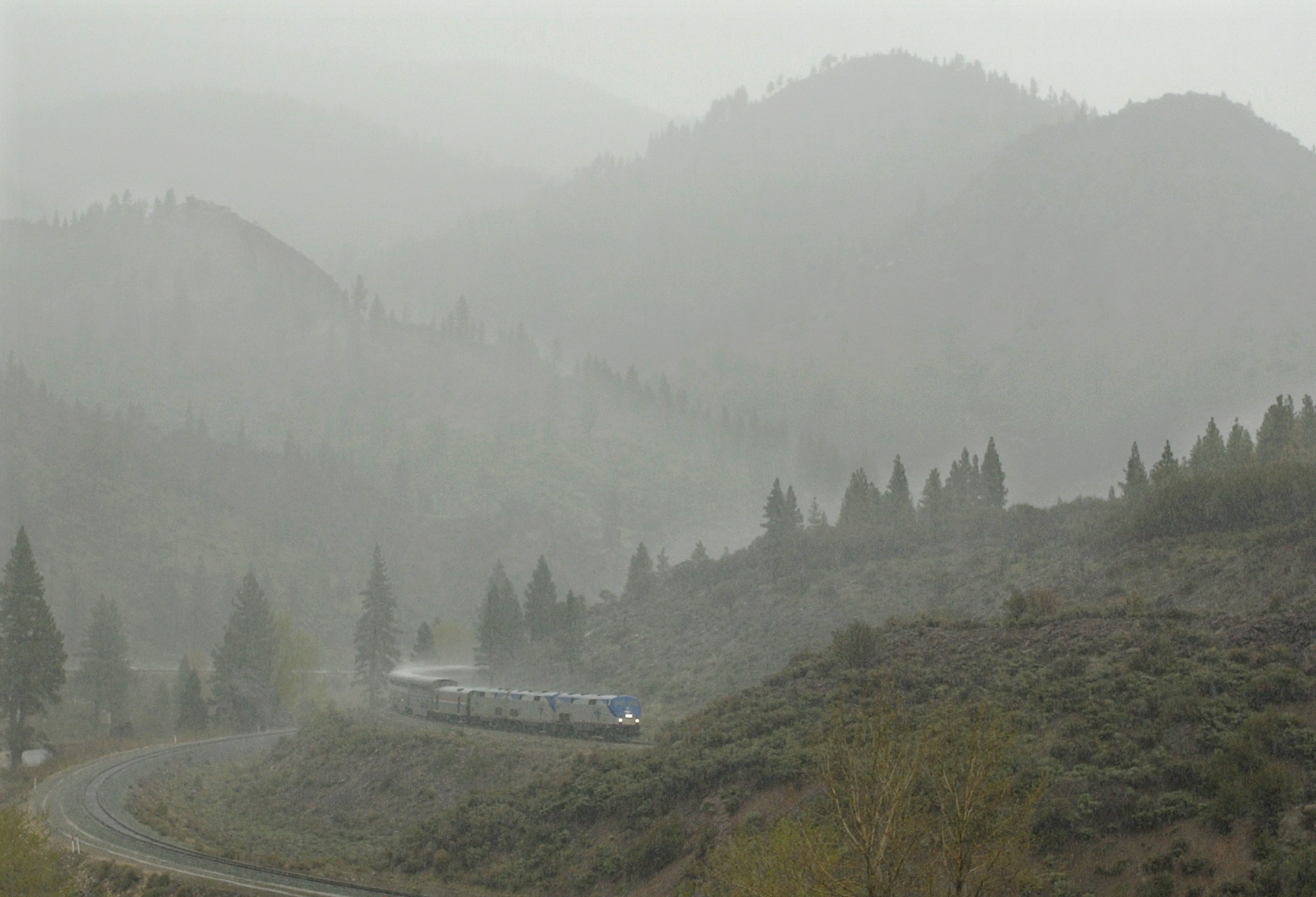 The westbound California Zephr begins its ascent of the Sierra Nevadas in Farad, Calif., during a rain and hail storm, April 26, 2002. It was in 1949 that three railroads created the first train called the California Zephyr, which quickly established a reputation as a scenic and luxurious way to the West Coast.<br />(Amy Sancetta / AP Photo)