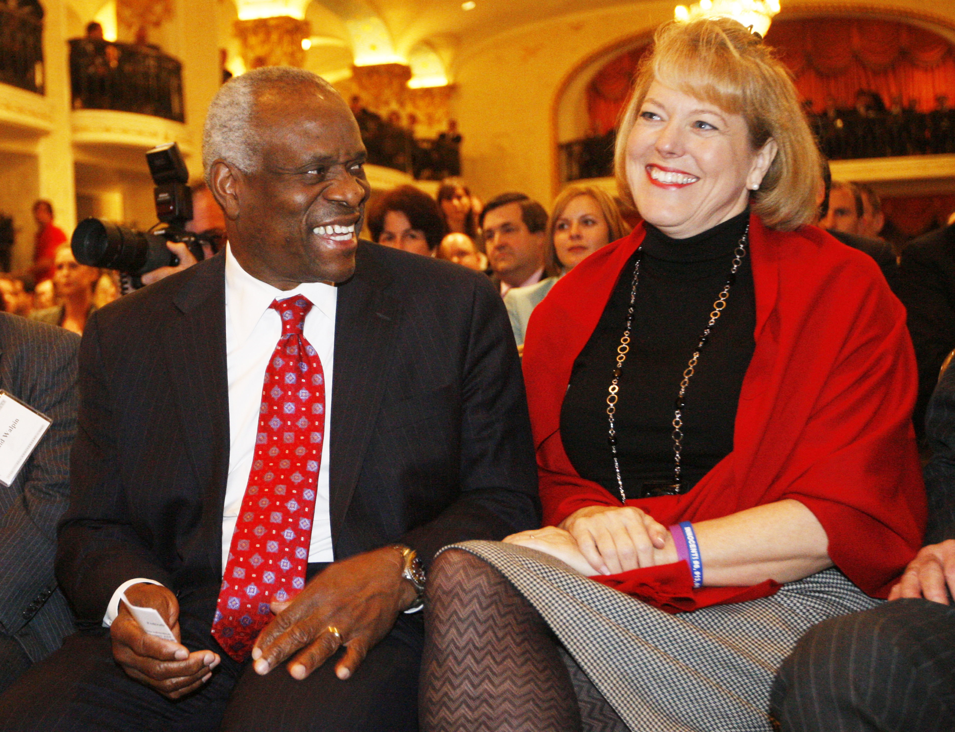 Supreme Court Justice Clarence Thomas (left) sits with his wife Virginia Lamp Thomas, as he is introduced at the Federalist Society in Washington, Thursday, Nov. 15, 2007.<br />(Charles Dharapak / AP Photo)