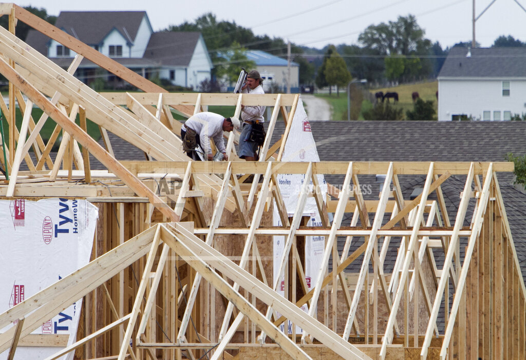 Builders work on a home in Omaha, Neb. ( Nati Harnik / AP Photo)
