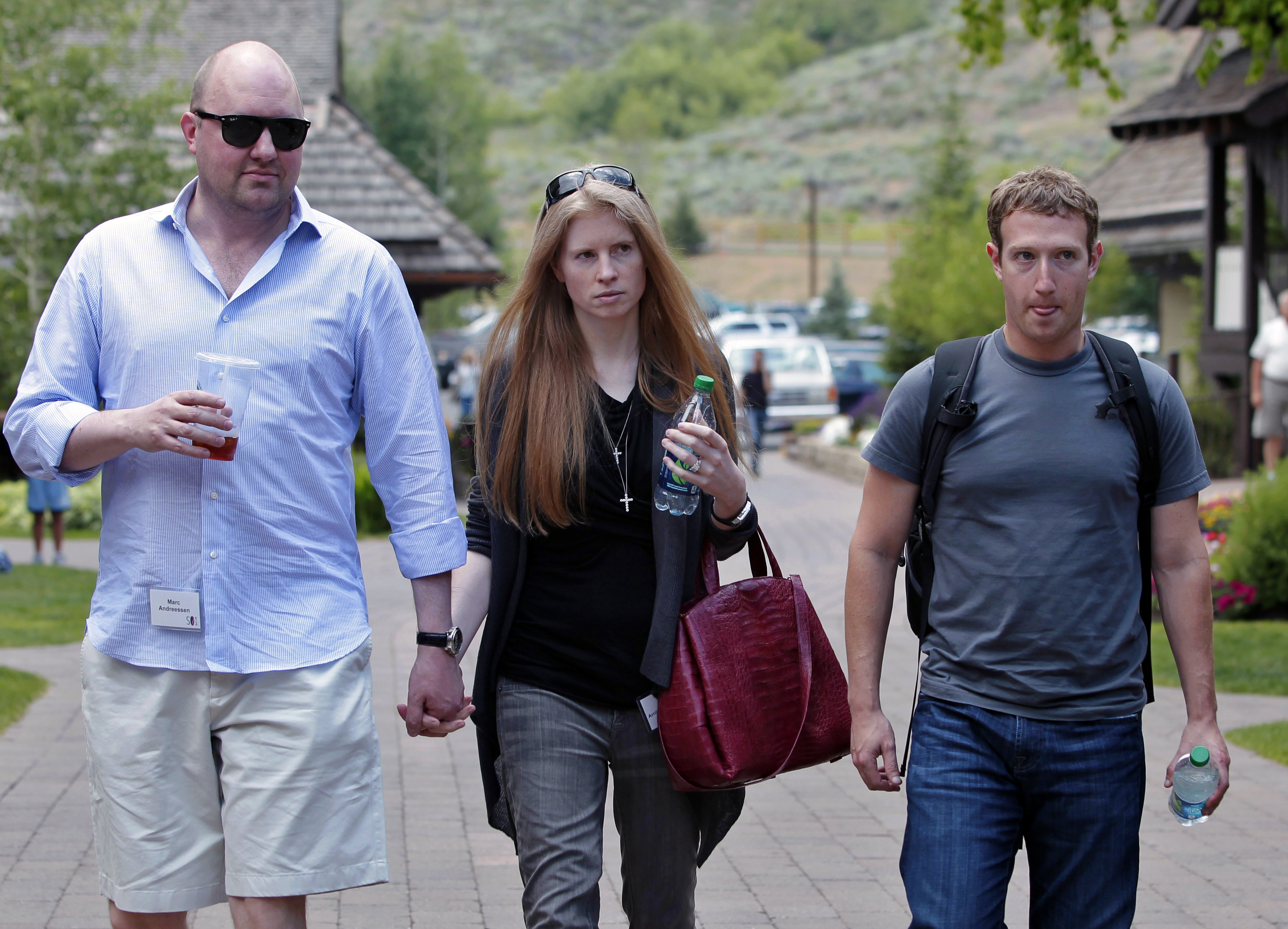 Facebook CEO Mark Zuckerberg (right) walks with Laura Arrillaga-Andreessen (center) wife of Marc Andreessen (left) at the Allen &amp; Company Sun Valley Conference in Sun Valley, Idaho, Wednesday, July 11, 2012.<br />(Paul Sakuma / AP Photo)