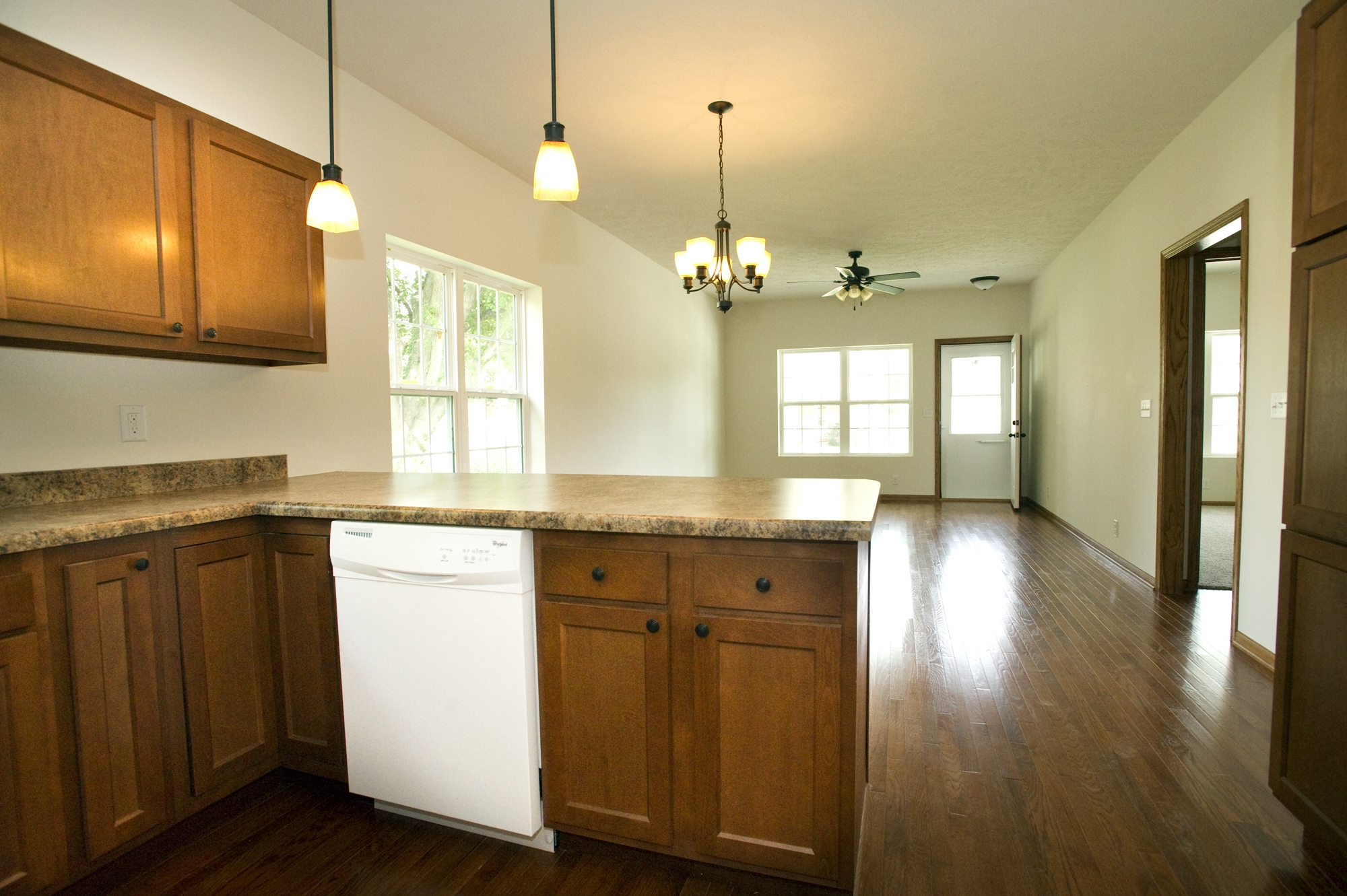 This Aug. 23, 2013, photo shows the front entrance, living room and kitchen of a three-bedroom, two-bathroom house for sale by the city in Lincoln, Neb. The new house is reserved for low-or moderate-income buyers earning no more than 80 percent of Lincoln&#039;s median income.<br />(Gwyneth Roberts / The Lincoln Journal-Star via AP)