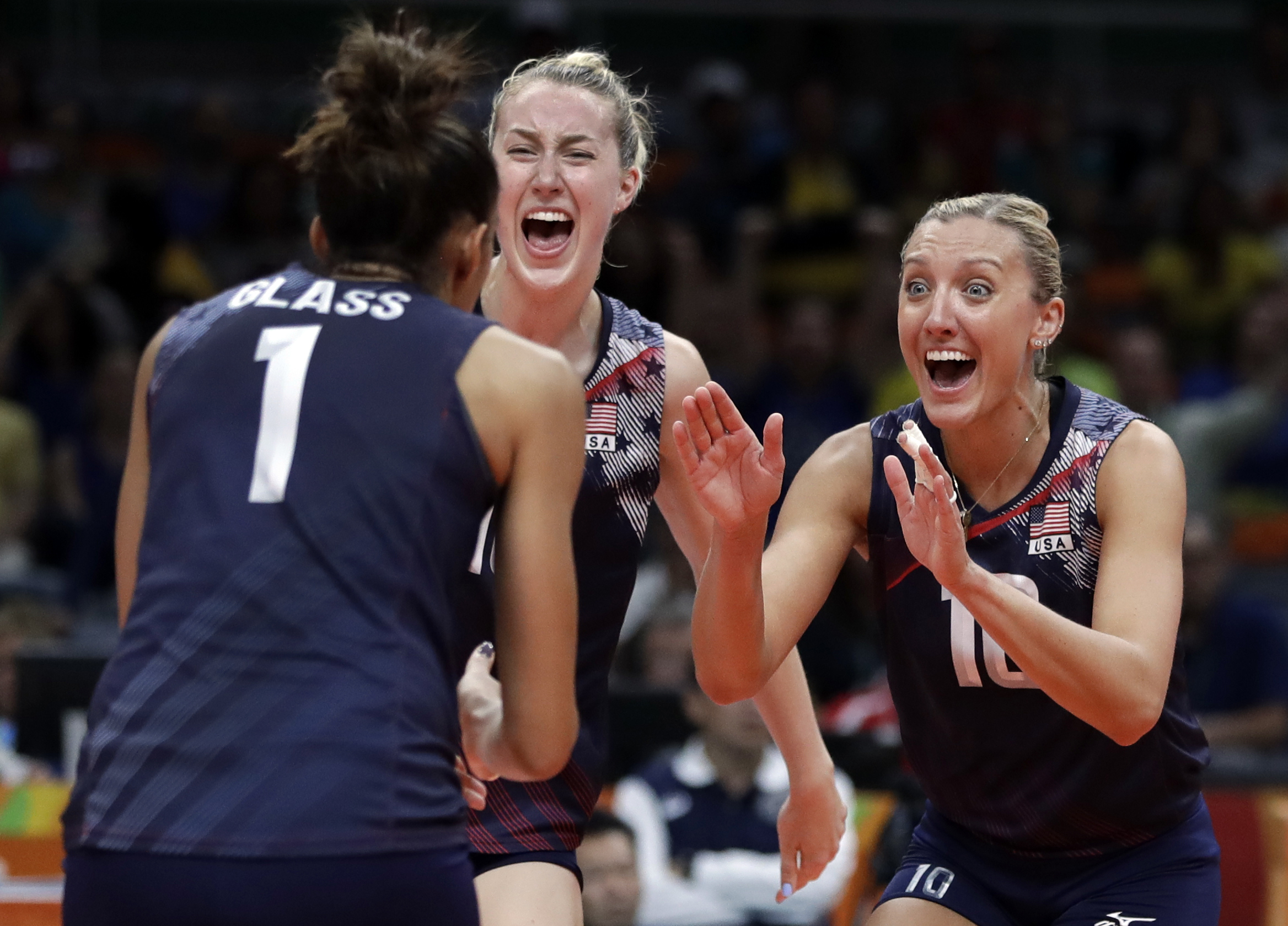 United States&#039; Jordan Larson (right) celebrates with teammates Alisha Glass (left) and Kim Hill during a women&#039;s quarterfinal volleyball match against Japan at the 2016 Summer Olympics in Rio de Janeiro, Brazil, Tuesday, Aug. 16, 2016.<br />(Jeff Roberson / AP Photo)