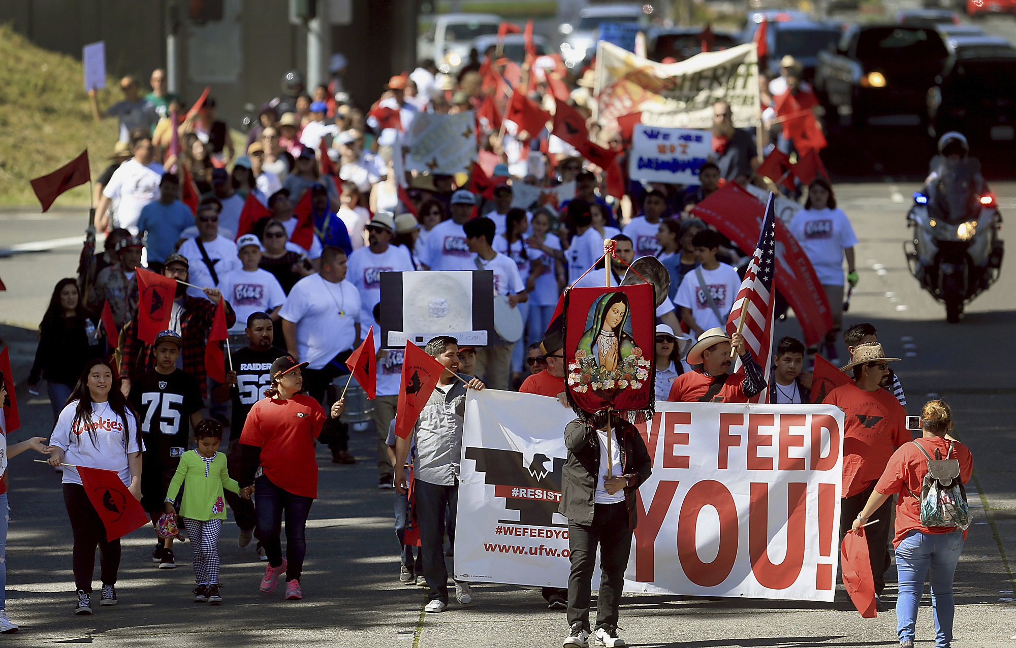 United Farm Worker supporters march up Third Street at Highway 101 during the annual Cesar Chavez/UFW march in Santa Rosa, Calif., Sunday, April 2, 2017.<br />(Kent Porter / The Press Democrat via AP)