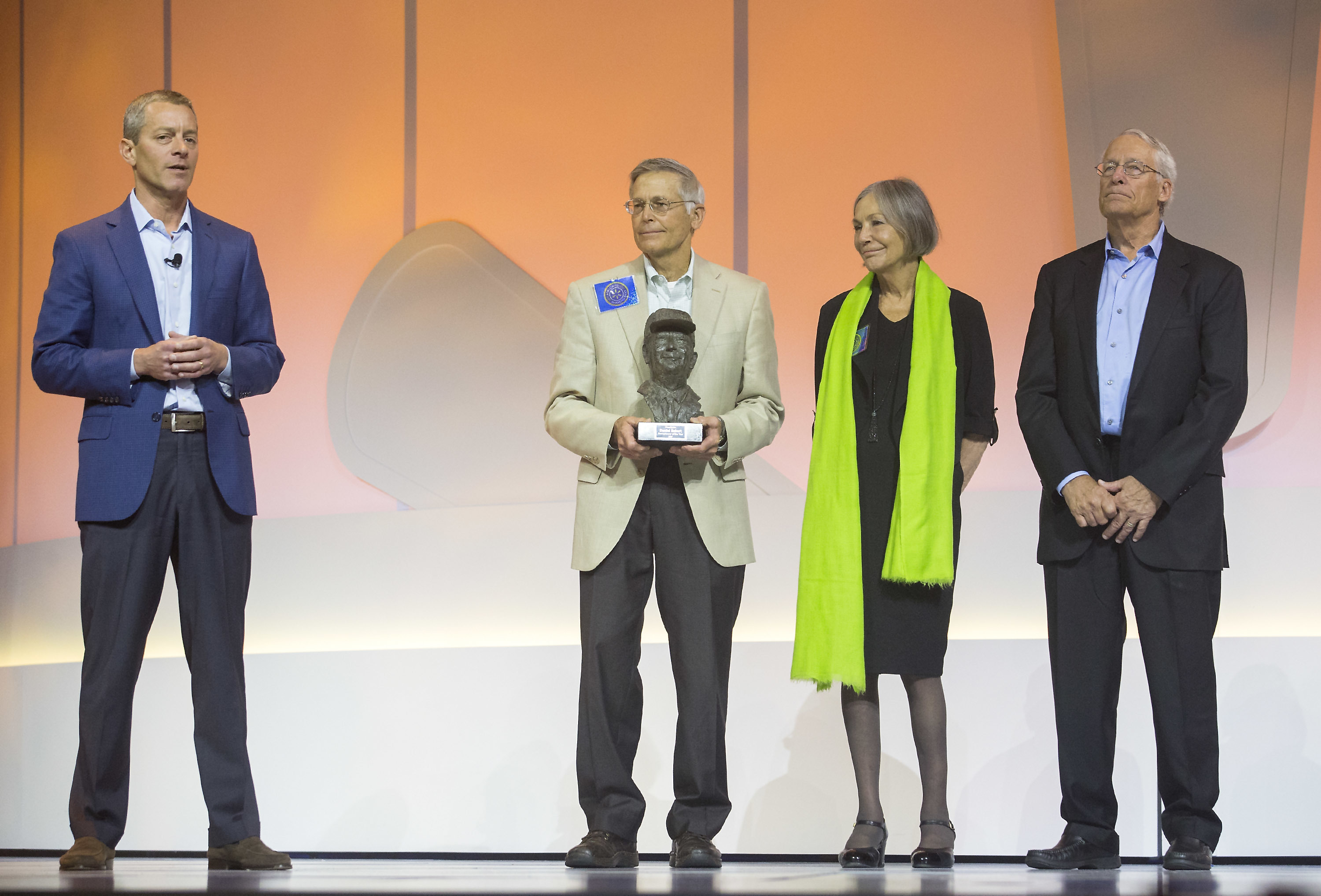 Greg Penner (left) board chairman, speaks alongside Jim Walton, Alice Walton and Rob Walton for the presentation of the Sam Walton Award during the Walmart shareholders meeting Friday, June 2, 2017, at Bud Walton Arena in Fayetteville, Ark.<br /> (Jason Ivester / The Northwest Arkansas Democrat-Gazette via AP)