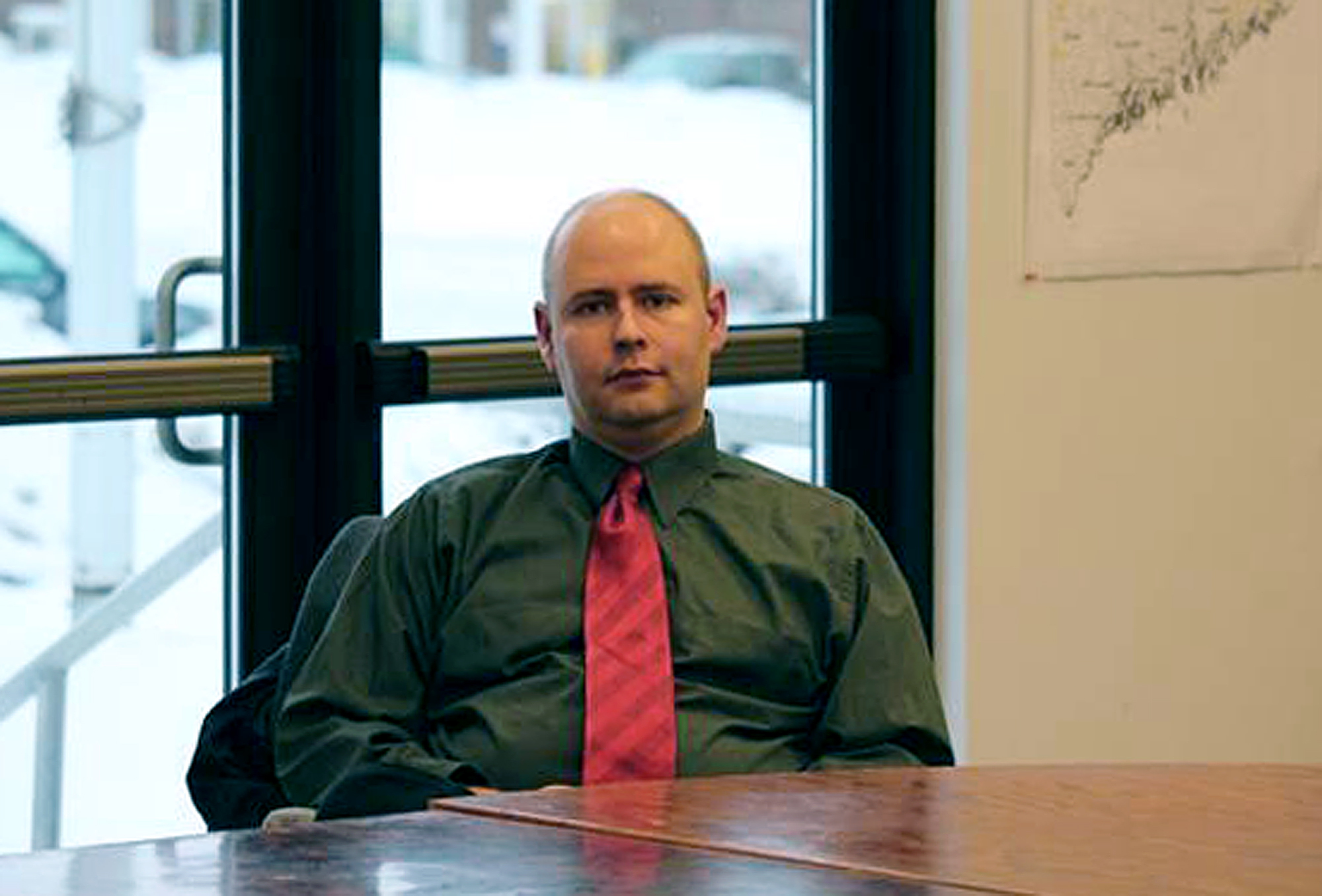 Town Manager Tom Kawczynski sits in the Jackman, Maine, town hall on Tuesday, Jan. 23, 2018, before a select board meeting over his publicly espoused white separatist views. The Jackman Select Board voted unanimously to dismiss him, announcing the decision after a closed-door executive session with Kawczynski, who had been the town&#039;s top administrator since June.<br />(Jake Bleiberg / The Bangor Daily News via AP)