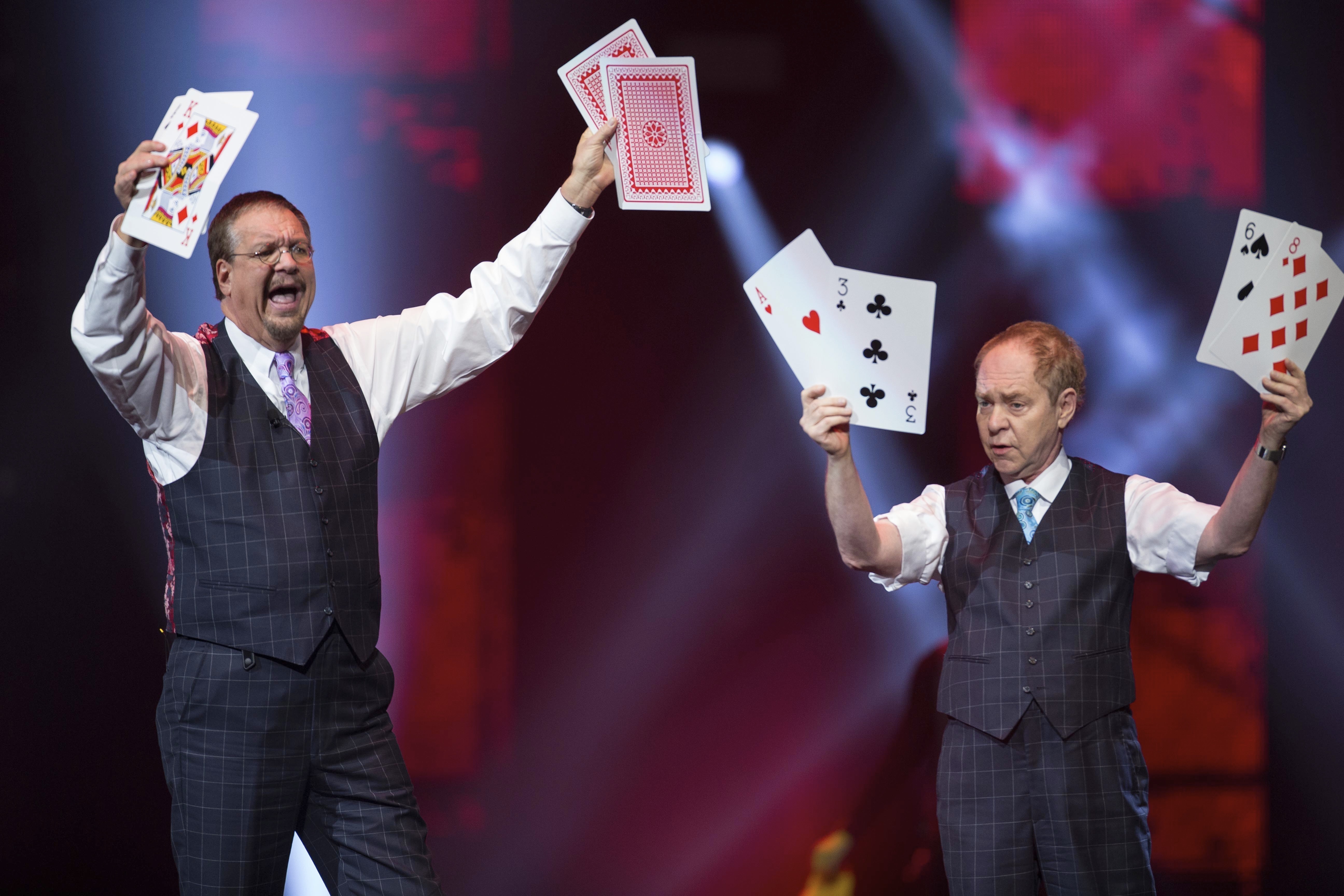 Penn Jillette (left) and Raymond Teller perform their &quot;Penn &amp; Teller&quot; act at the Vegas Strong Benefit concert in Las Vegas.<br />(Eric Jamison / Invision / AP Photo)