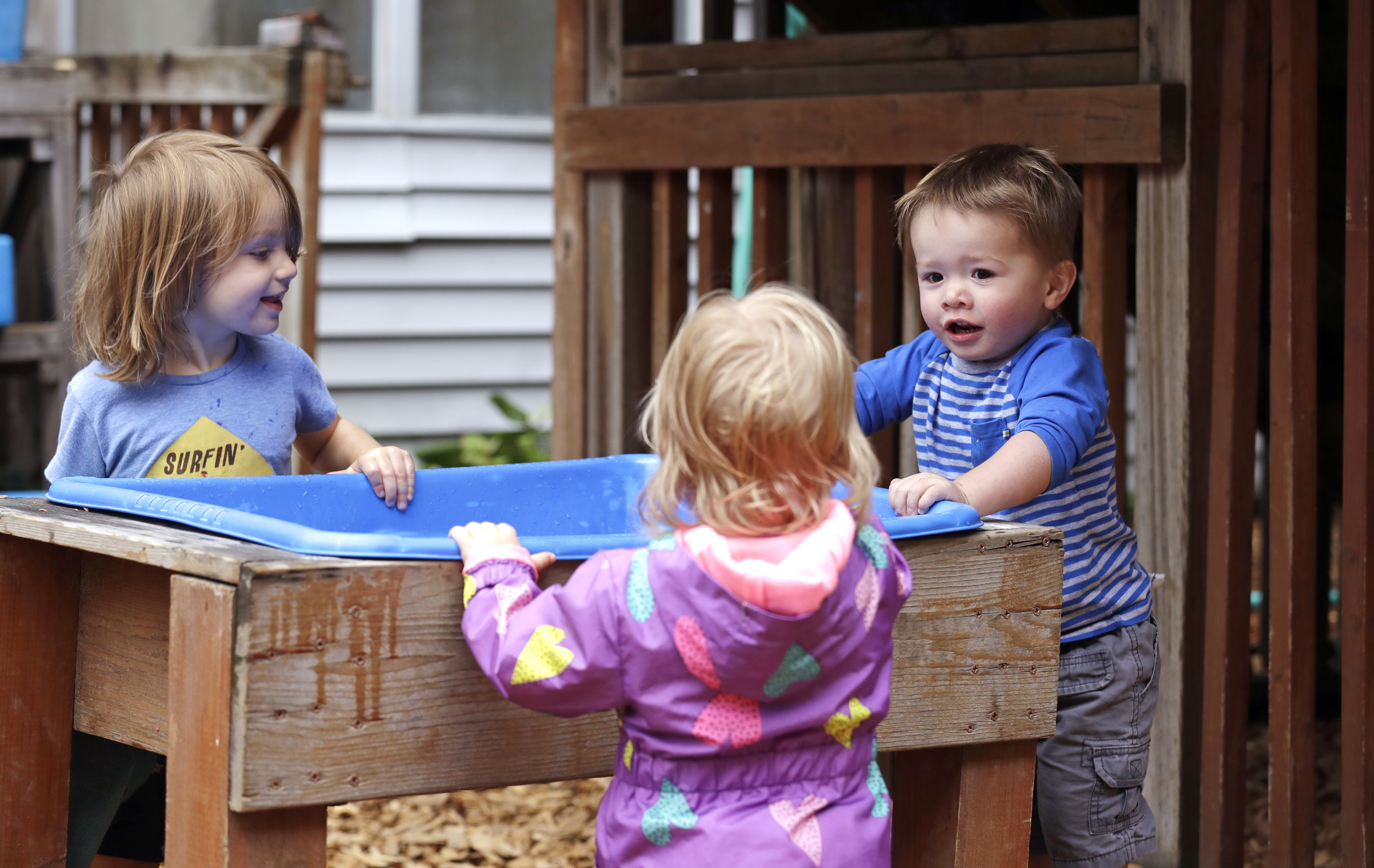 A dire workforce crisis in a booming U.S. economy is forcing many in the child care industry to turn to business tactics more closely resembling Wall Street than Sesame Street. Non-compete and &quot;hold-harmless&quot; legal agreements, college tuition incentives for workers and steep waiting-list fees for parents are fast becoming the norm.<br /> (Elaine Thompson / AP Photo)