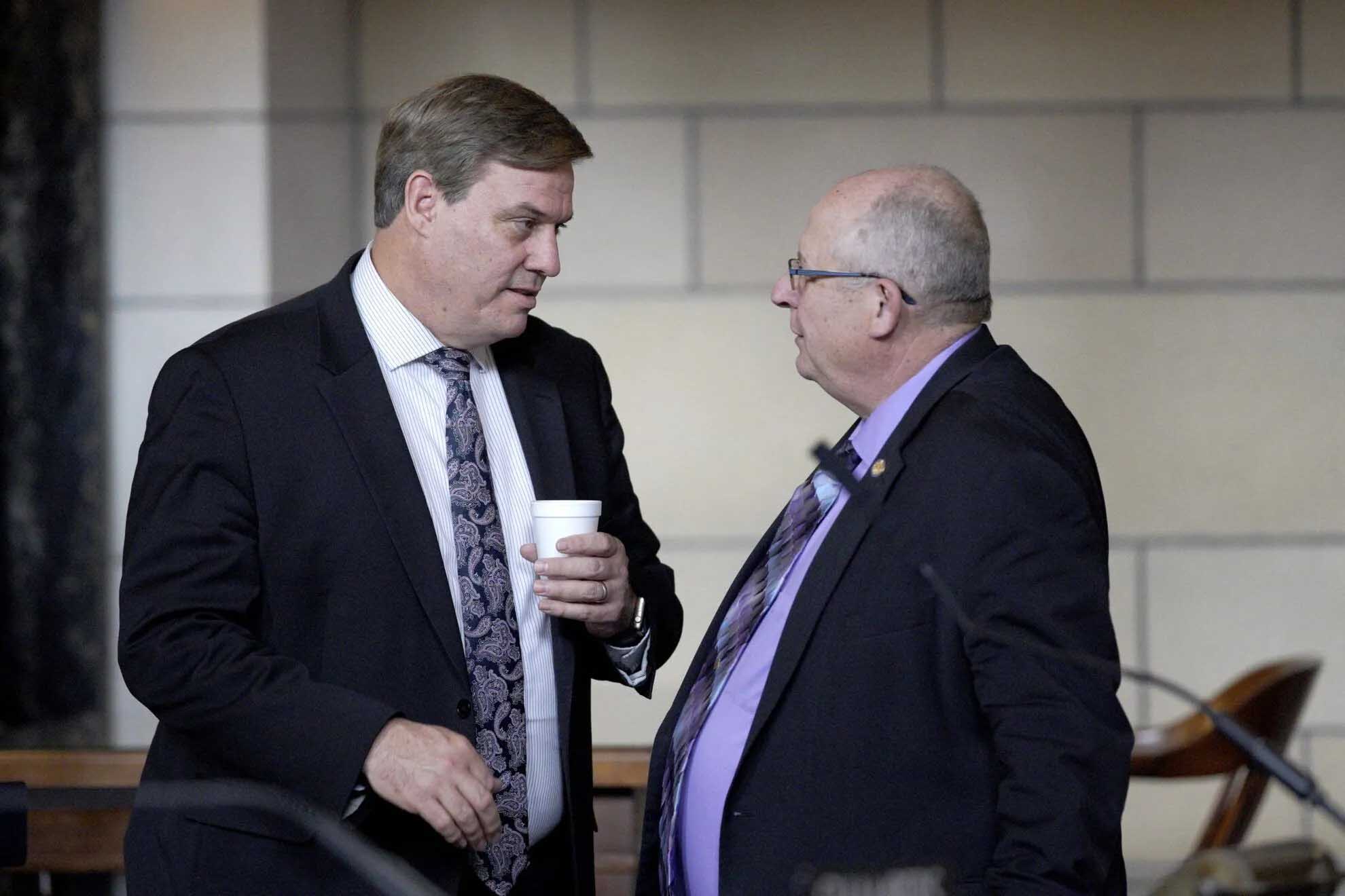 Mike McDonnell, then a state senator from Omaha (left) talks to Sen. Curt Friesen in the Legislature in Lincoln in 2019. McDonnell became a Republican in 2024, switching parties after voting for abortion restrictions that angered Democrats.<br />(Nati Harnik / AP Photo)