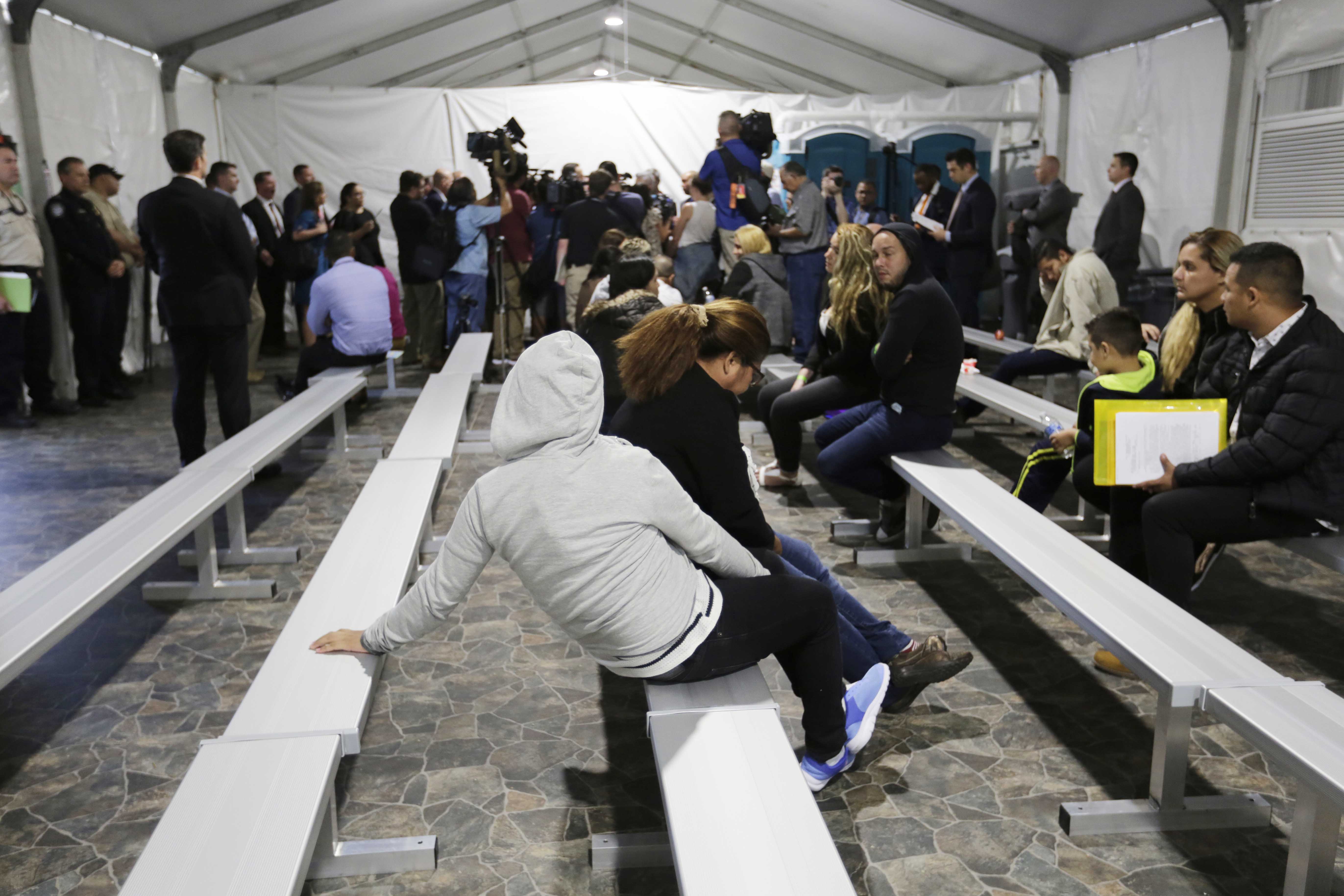 Sept. 17, 2019, migrants who were applying for asylum in the United States went through a processing area at a tent courtroom at the Migration Protection Protocols Immigration Hearing Facility, in Laredo, Texas. More immigration judges were overseeing hearings remotely in secretive tent courts the U.S. government built along the southern border.<br />(Eric Gay / AP Photo)