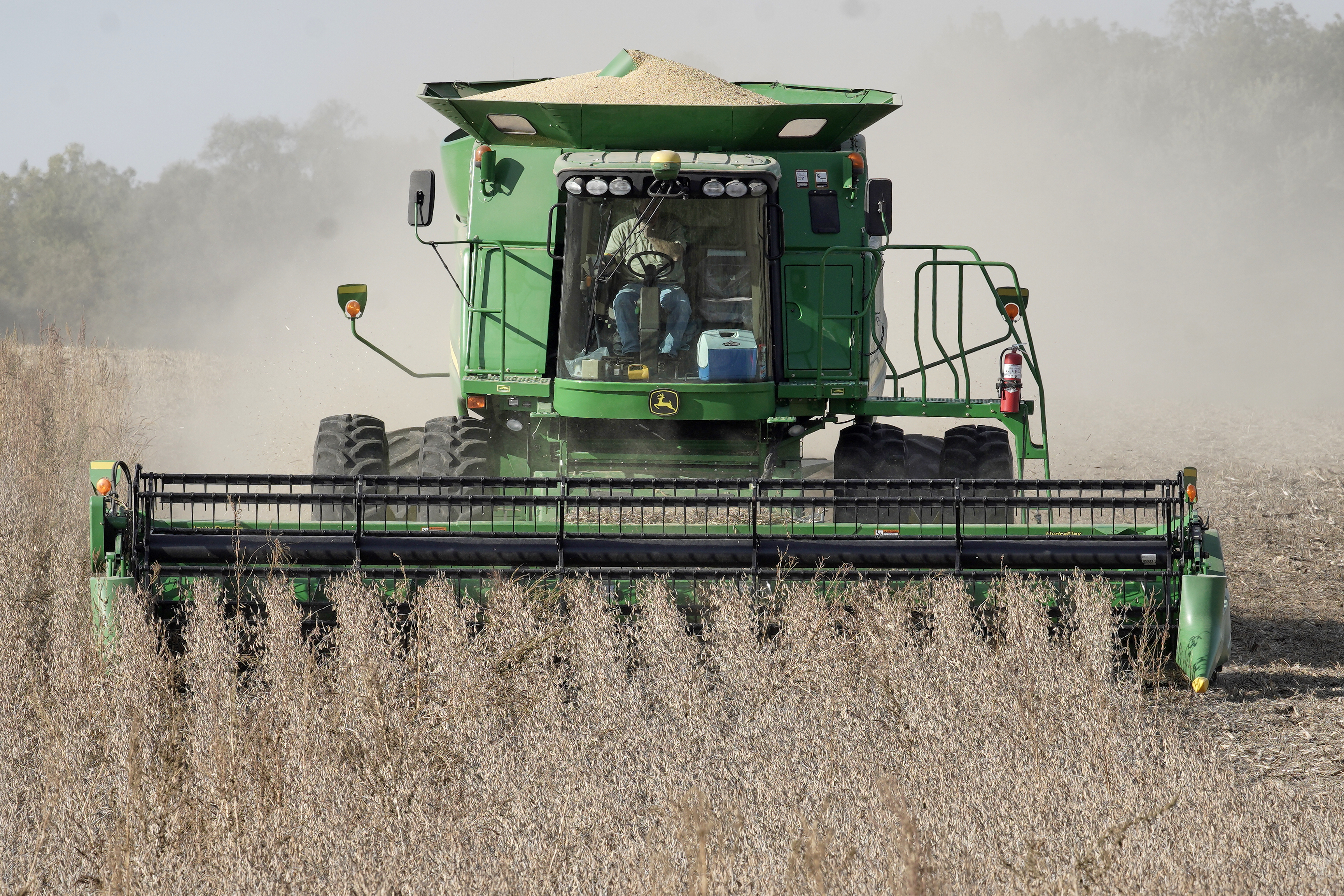 A combine harvests soybeans in rural Blair, Neb., Thursday, Oct. 17, 2019.<br /> (Nati Harnik / AP Photo)