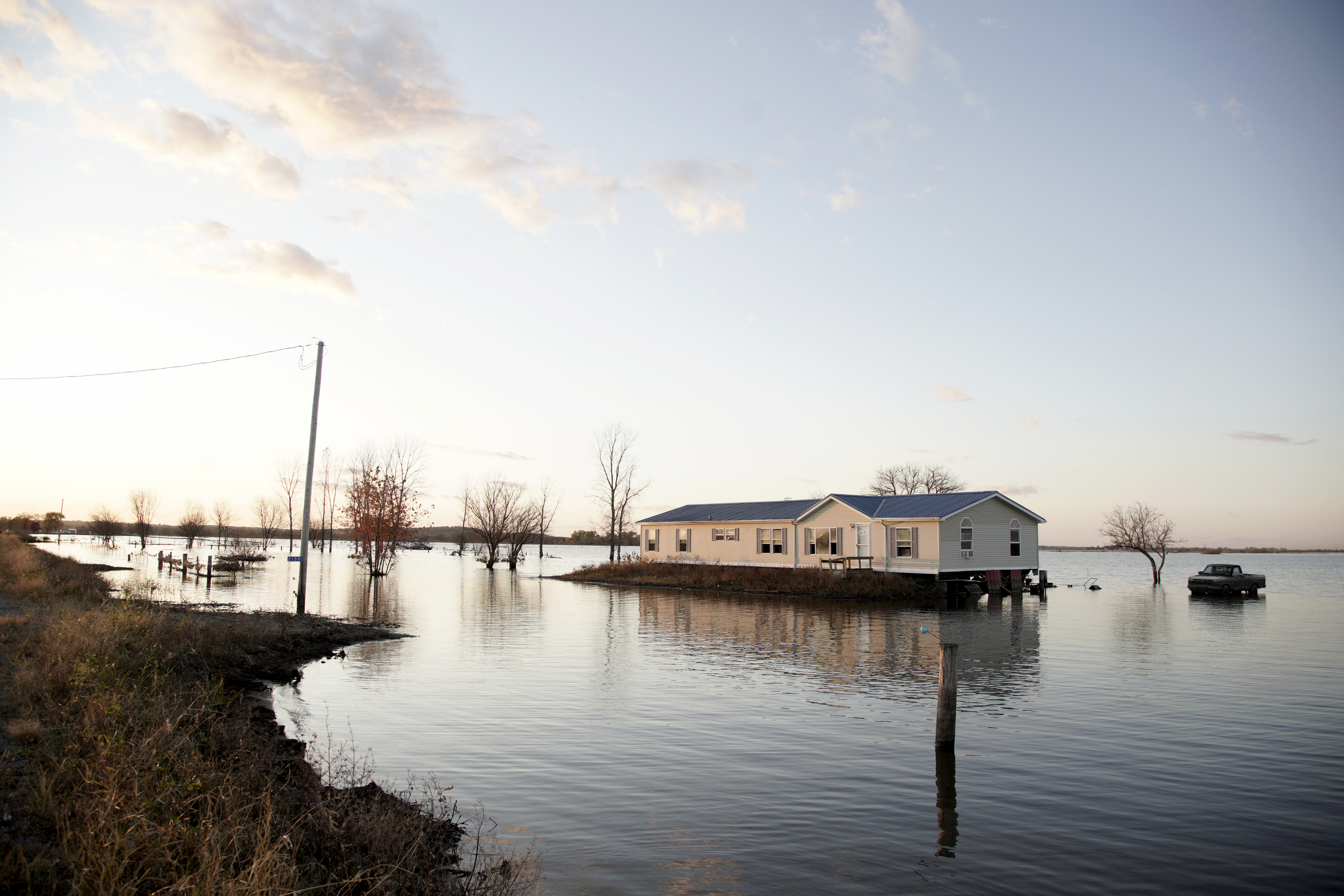 In this Oct. 22, 2019 photo, a home is surrounded by flood waters from the Missouri River in Bartlett, Iowa.<br />(Nati Harnik / AP Photo