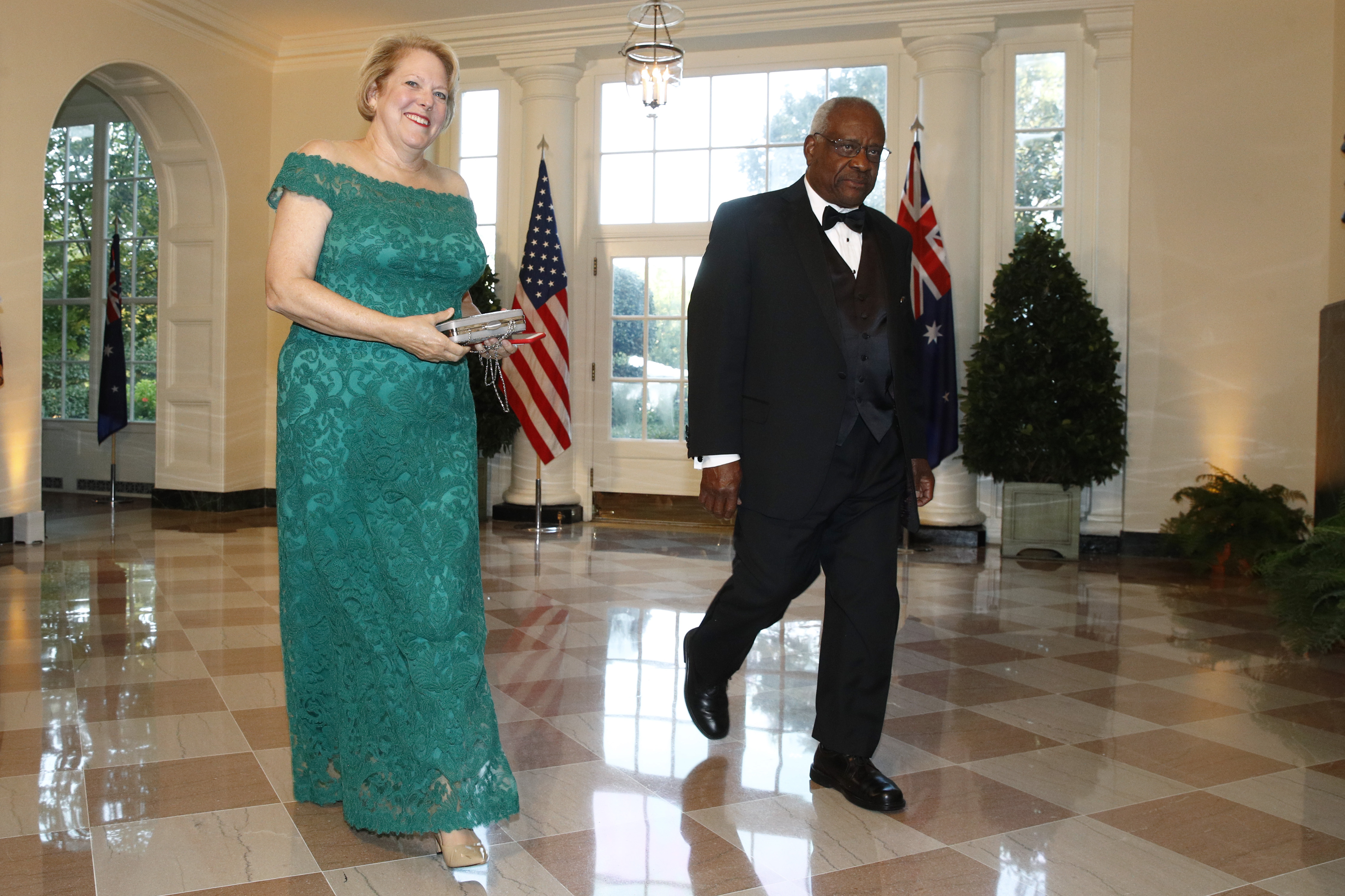 Supreme Court Associate Justice Clarence Thomas, right, and wife Virginia “Ginni” Thomas arrive for a State Dinner with Australian Prime Minister Scott Morrison and President Donald Trump at the White House in Washington. (Patrick Semansky / AP Photo)