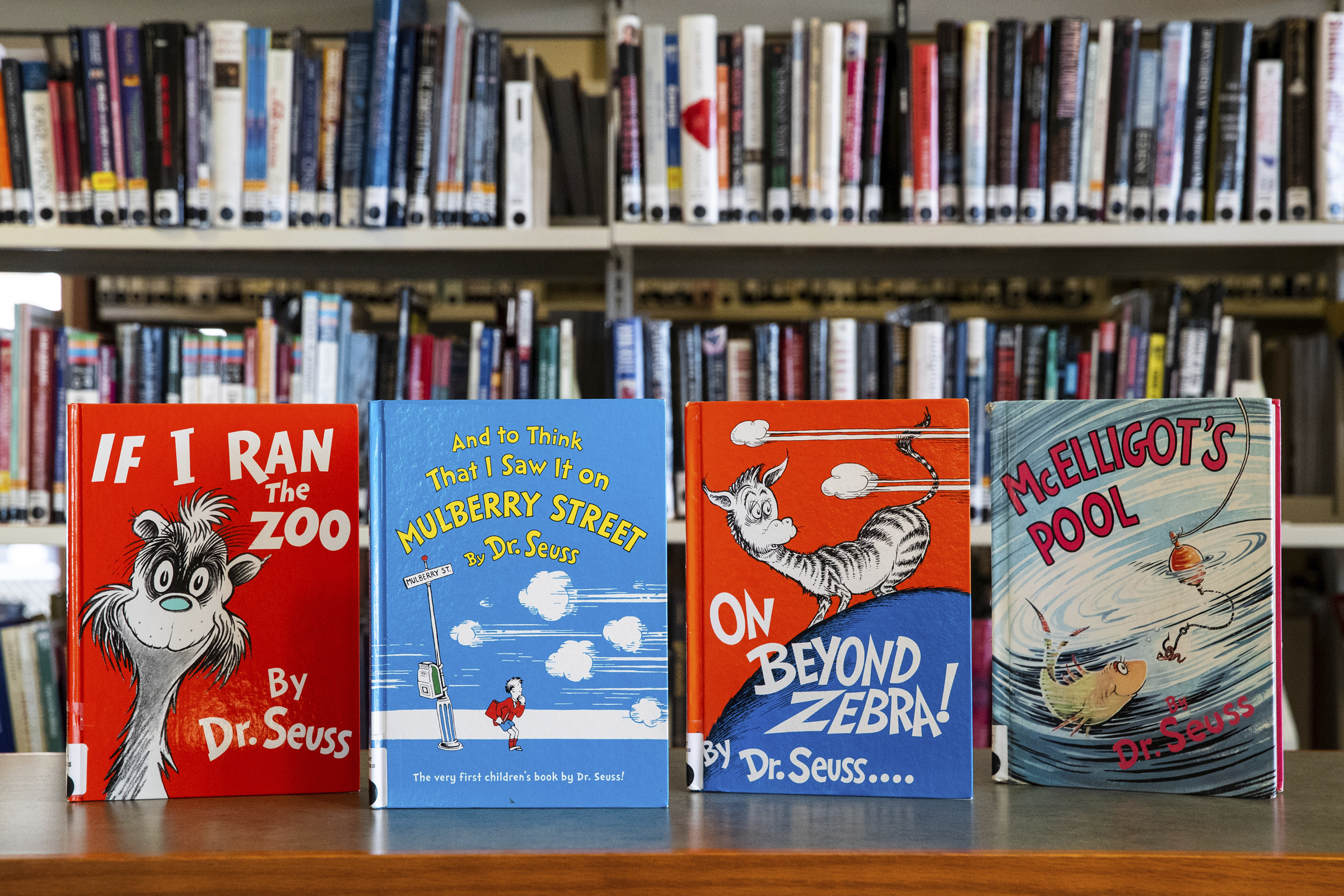 Dr. Seuss childrens&#039; books (from left) &quot;If I Ran the Zoo,&quot; &quot;And to Think That I Saw It on Mulberry Street,&quot; &quot;On Beyond Zebra!&quot; and &quot;McElligot&#039;s Pool&quot; are displayed at the North Pocono Public Library in Moscow, Pa., Tuesday, March 2, 2021.<br />(Christopher Dolan / The Times-Tribune via AP)