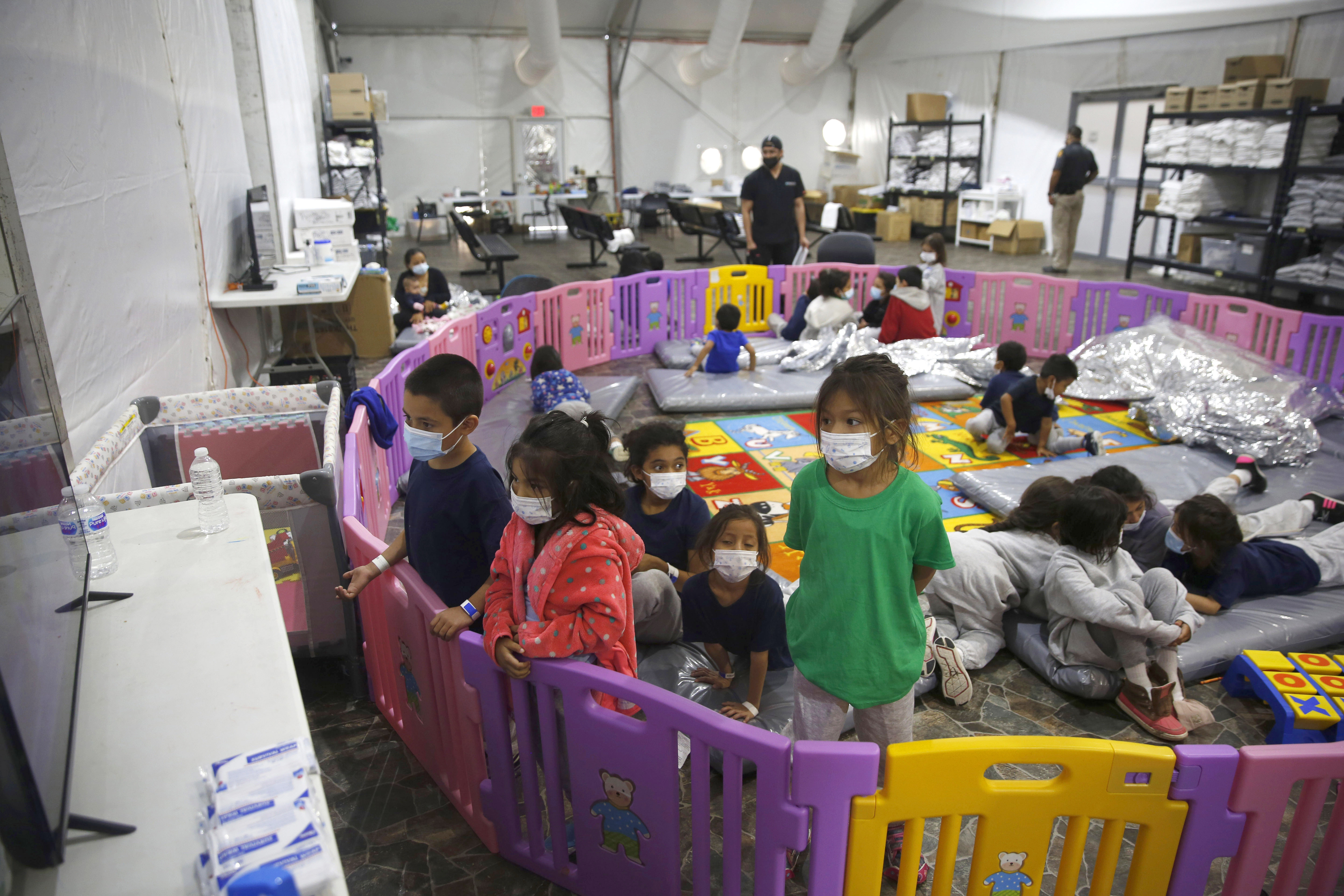 March 30, 2021, young unaccompanied migrants, from ages 3 to 9, watch television inside a playpen at the U.S. Customs and Border Protection facility, the main detention center for unaccompanied children in the Rio Grande Valley, in Donna, Texas.<br />(Dario Lopez-Mills / AP Photo)