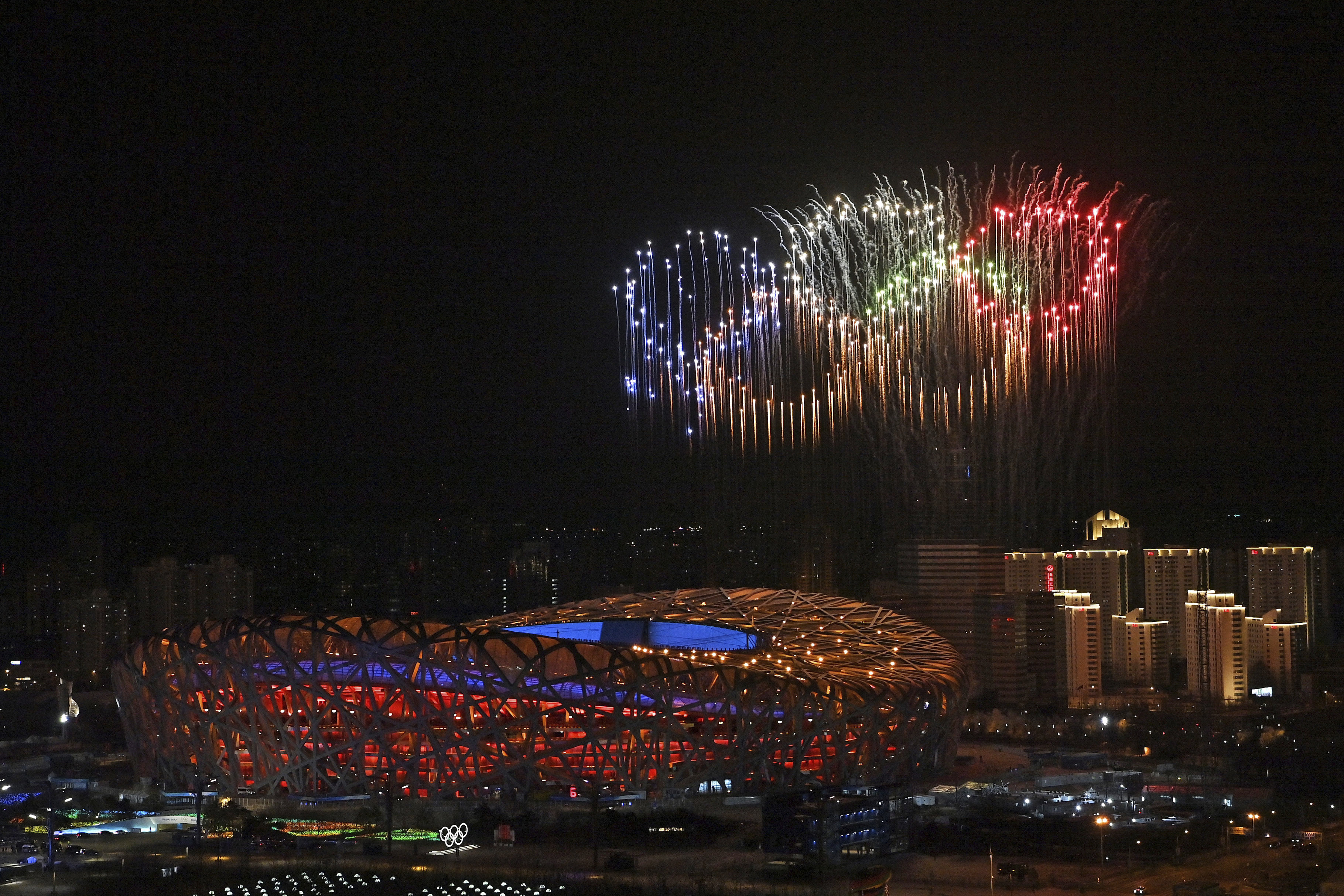 Fireworks, forming the Olympic rings, illuminate the sky during the opening ceremony of the 2022 Winter Olympics, Friday, Feb. 4, 2022, in Beijing. (Li Xin / Xinhua via AP Photo)
