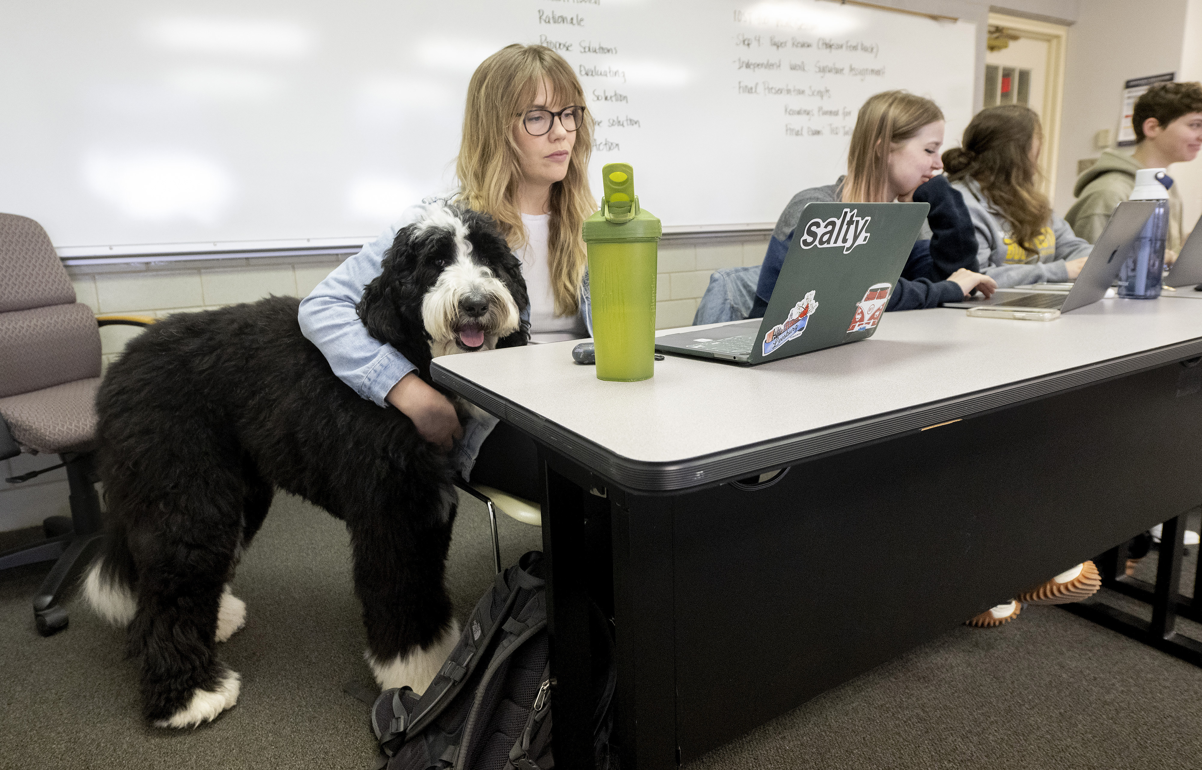 Student Tatiana Kelly hugs Cooper, a therapy dog being trained by Buena Vista University education professor Calle Friesen, Tuesday, March 29, 2022, during one of Friesen&#039;s classes at the Storm Lake, Iowa, university.<br />(Tim Hynds / Sioux City Journal via AP)