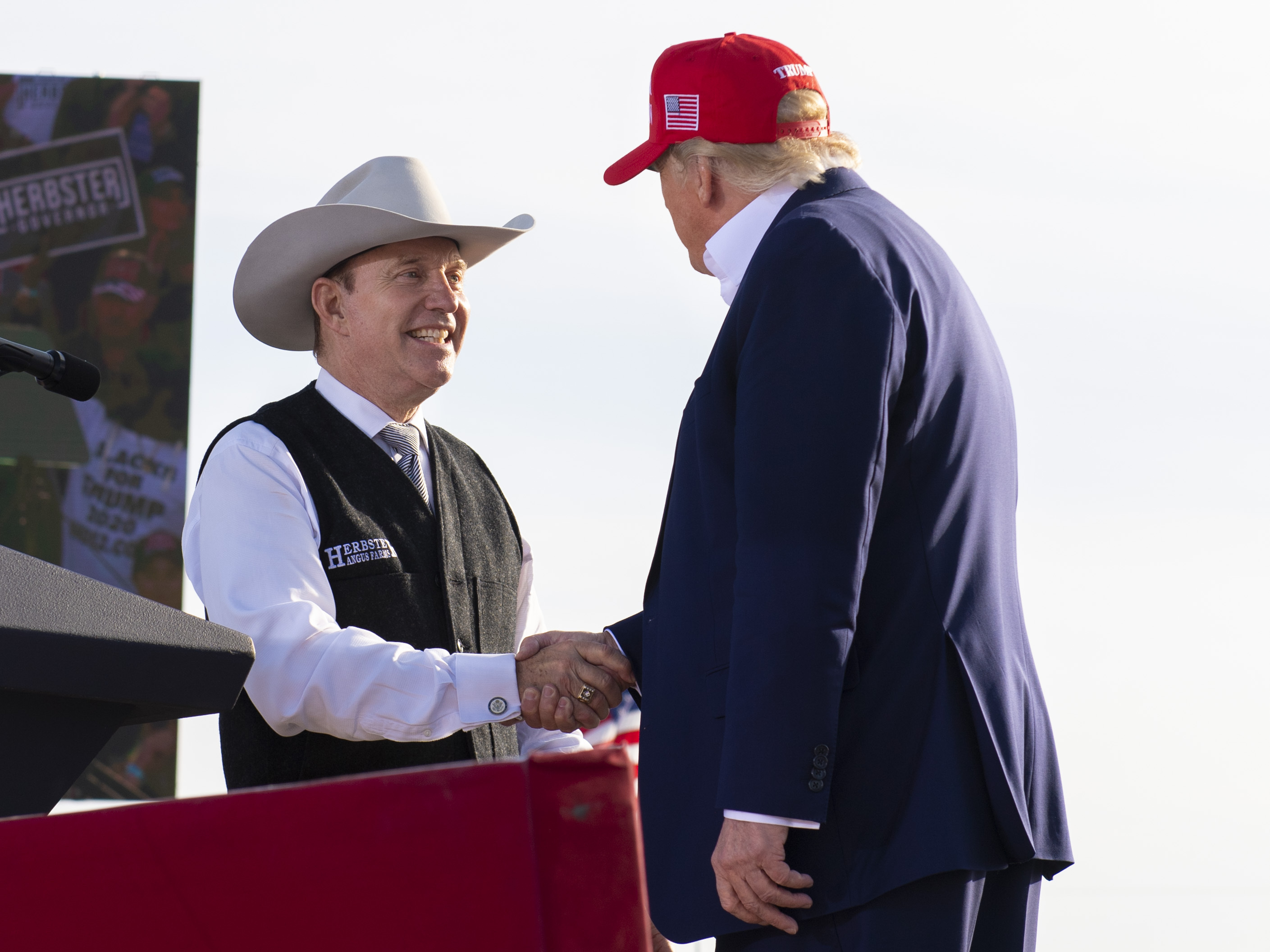 Nebraska Republican gubernatorial candidate Charles Herbster (left) shakes hands with former President Donald Trump during a campaign rally for Herbster, May 1, 2022, in Greenwood, Neb.<br /> (Kenneth Ferriera / Lincoln Journal Star via AP)