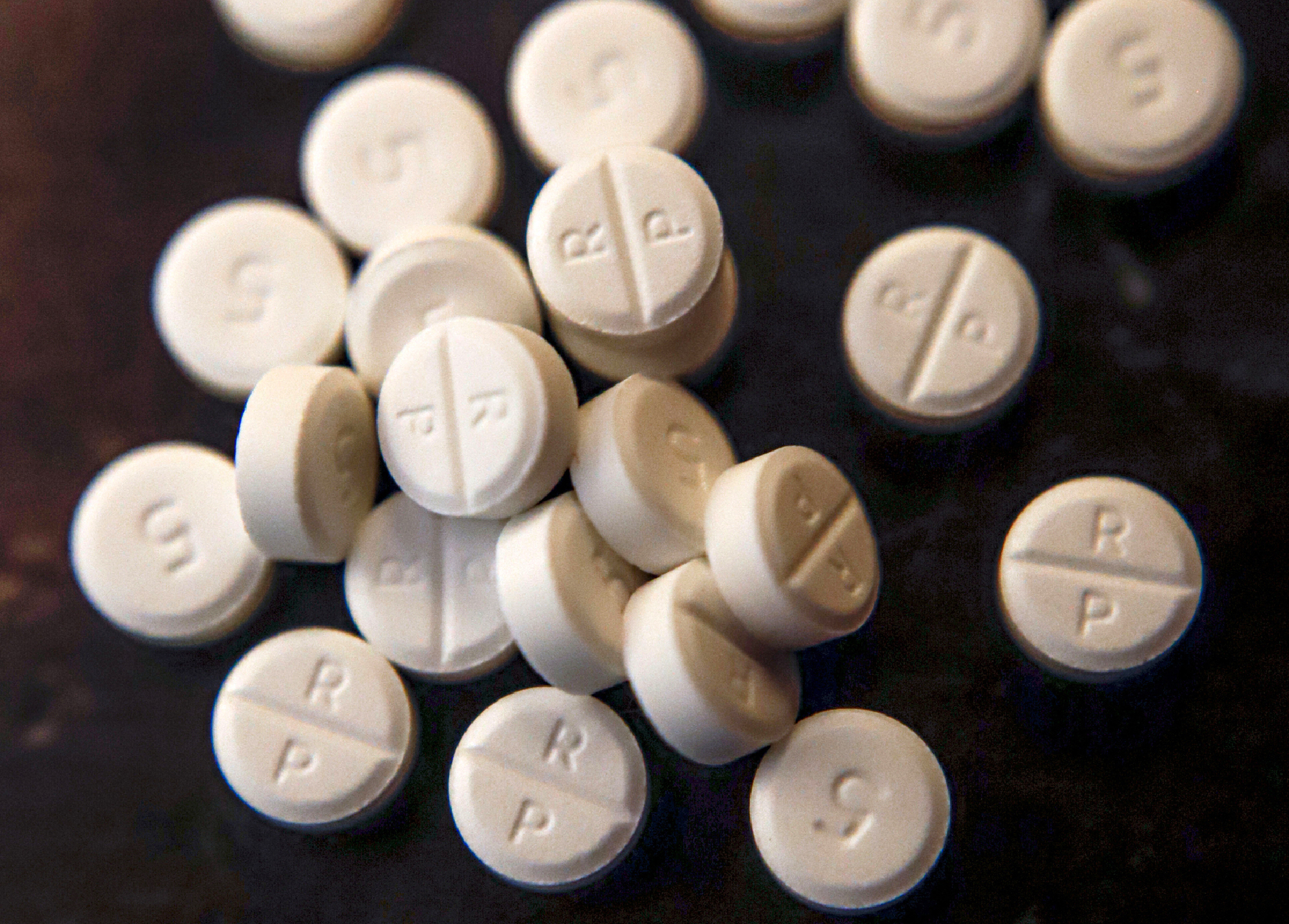 Oxycodone pills are shown, June 17, 2019. On Wednesday, Nov. 2, 2022, CVS Health said it has agreed to pay about $5 billion to state, local and Native American tribal governments to settle lawsuits over the toll of opioids. CVS is not admitting wrongdoing and the company would make the payments over a decade. (Keith Srakocic / AP Photo)