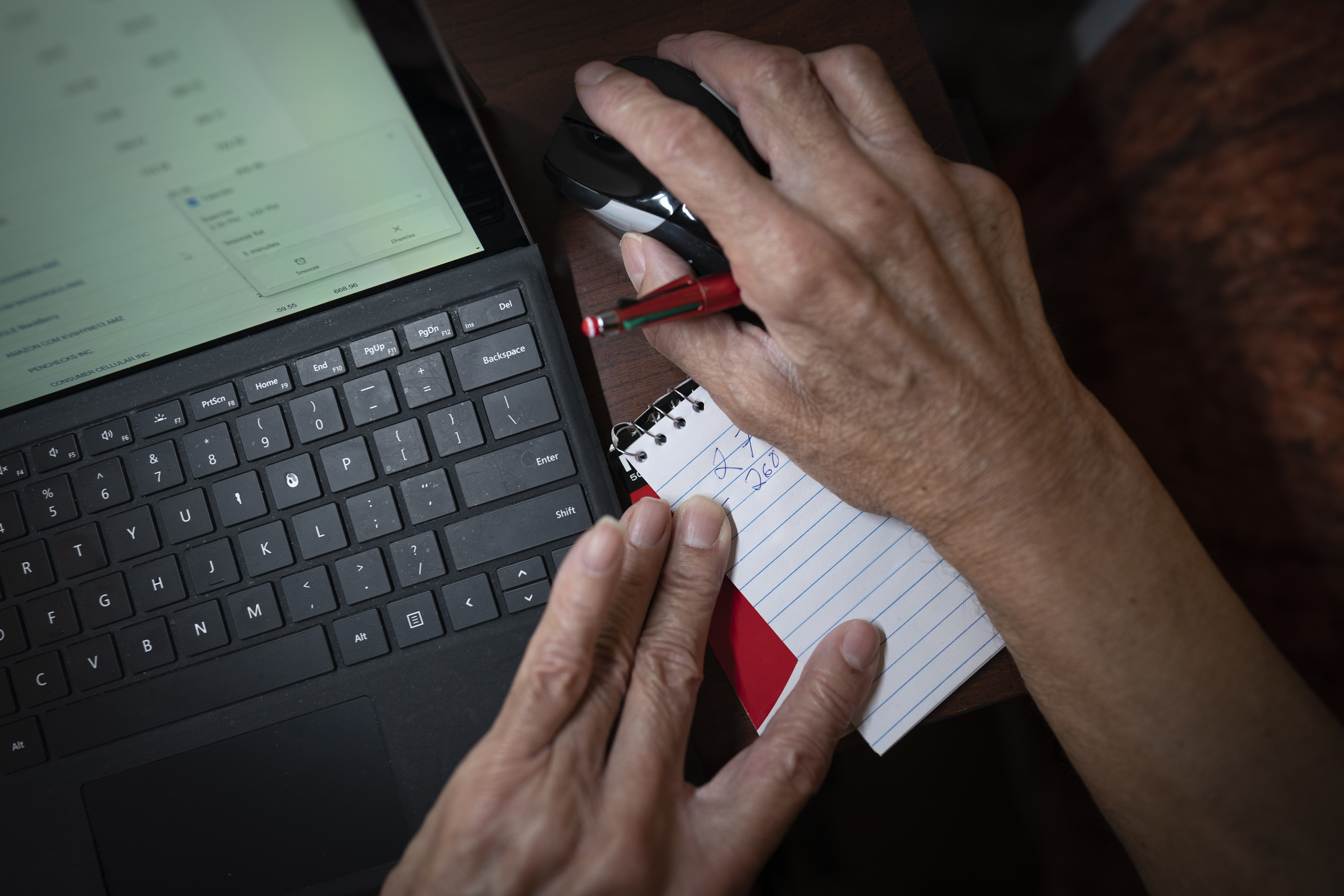 Alex Morisey calculates his finances and how much he would have left if he were to buy himself a pair of pants. Hundreds of thousands of nursing home residents in the U.S. rely on Medicaid’s personal needs allowance as their only source of income. In some states, the allowance is just $30 a month. (Wong Maye-E / AP Photo)