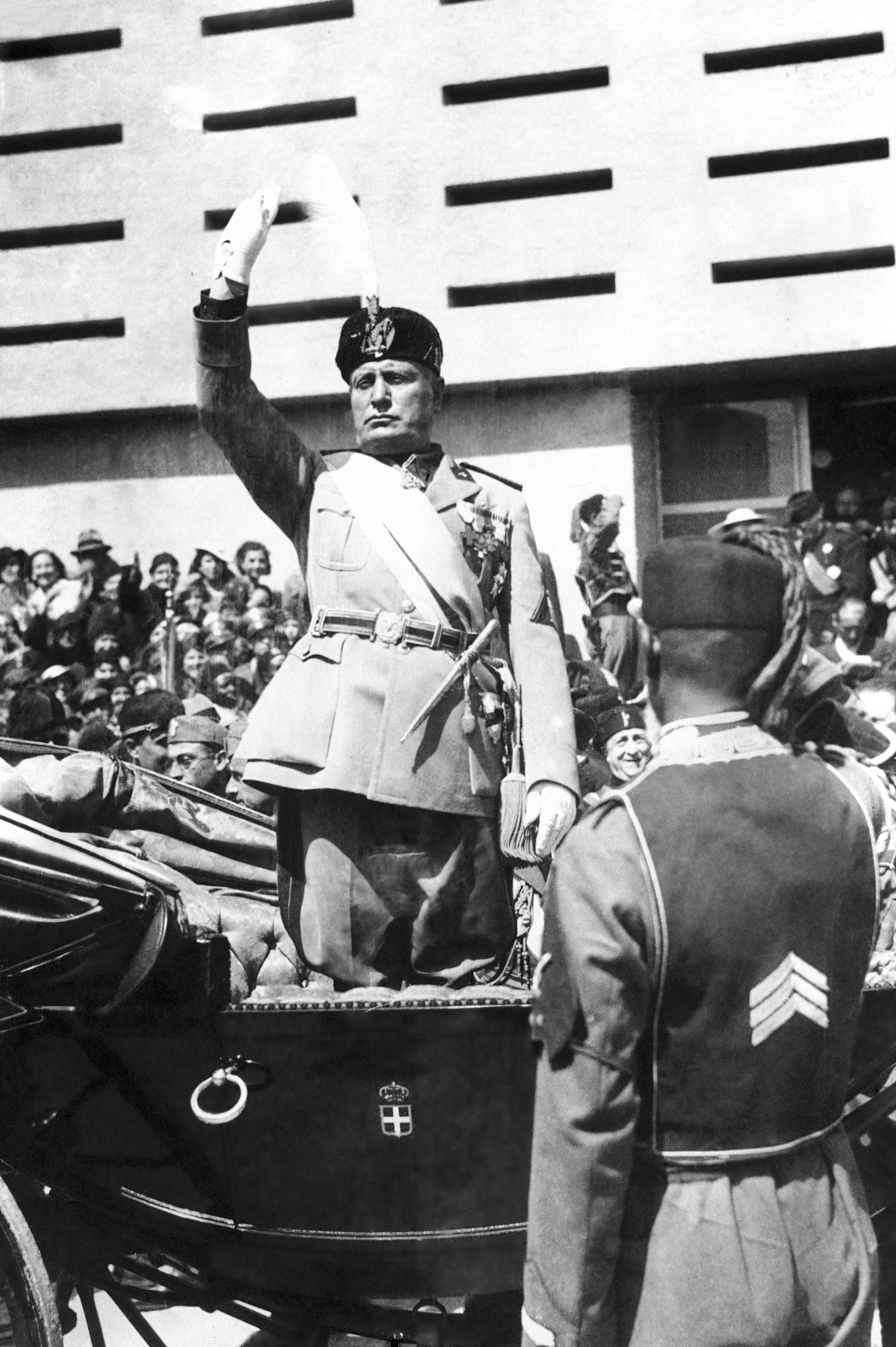 Italian dictator Benito Mussolini gives the Fascist salute before making his speech at the open ceremony of the Tripoli fair, in Tripoli, Libya, March 17, 1937.<br />(AP Photo)