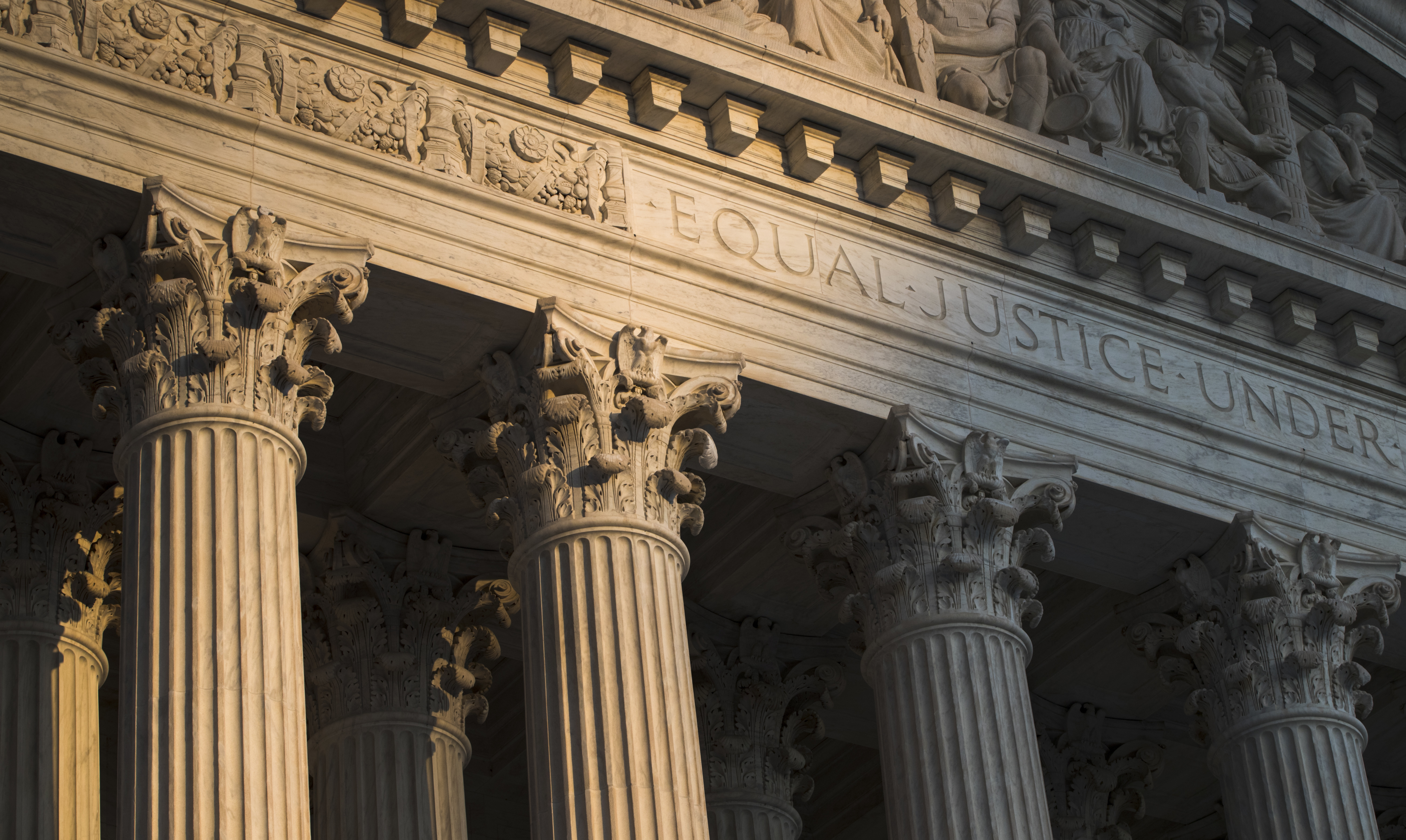 The Supreme Court in Washington is seen at sunset on Oct. 10, 2017. In a monthslong inquiry, which included reviewing tens of thousands of pages of documents from more than 100 public records requests, The Associated Press has examined what happens behind the scenes when Supreme Court justices travel to colleges and universities for lectures and other events. (J. Scott Applewhite / AP Photo)
