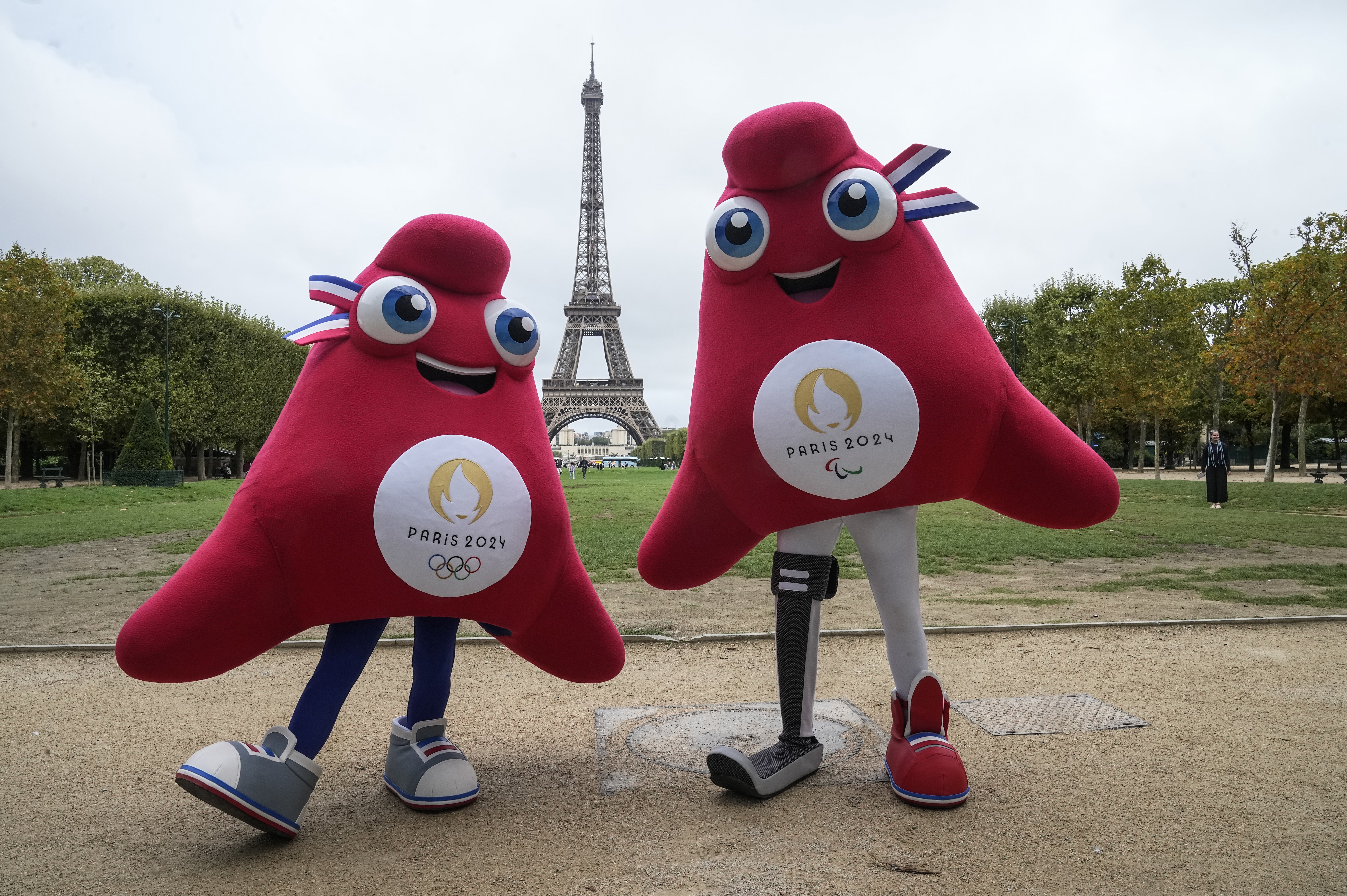 Mascots of the 2024 Paris Olympic Games (left) and Paralympics Games (right) pose next to the Eiffel Tower in Paris, Monday, Aug 28, 2023. “The Phryges” are meant to be Phrygian caps that symbolize the French Republic and freedom.<br />(Michel Euler / AP Photo)